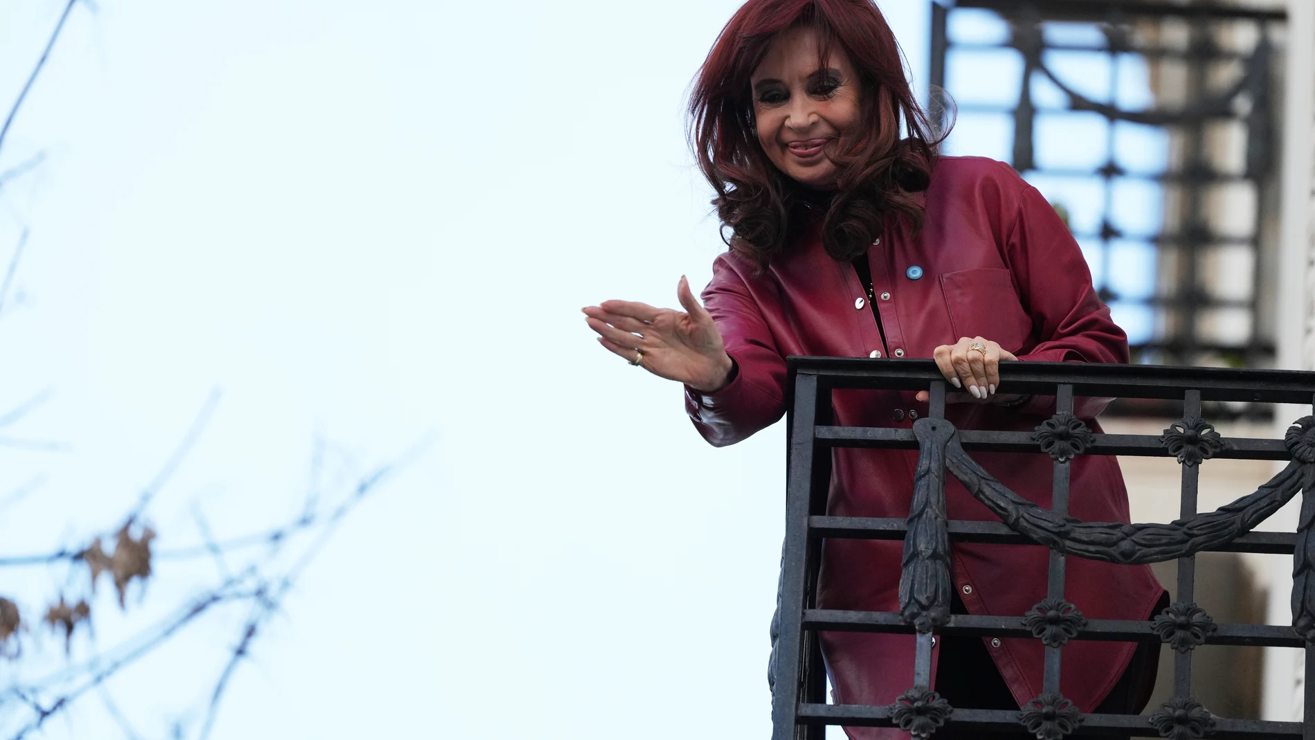 Argentina's former President Cristina Fernandez waves to supporters from her home's balcony two days after Argentina's Supreme Court upheld her corruption conviction in Buenos Aires, Argentina, Thursday, June 12, 2025. (AP Photo/Natacha Pisarenko)