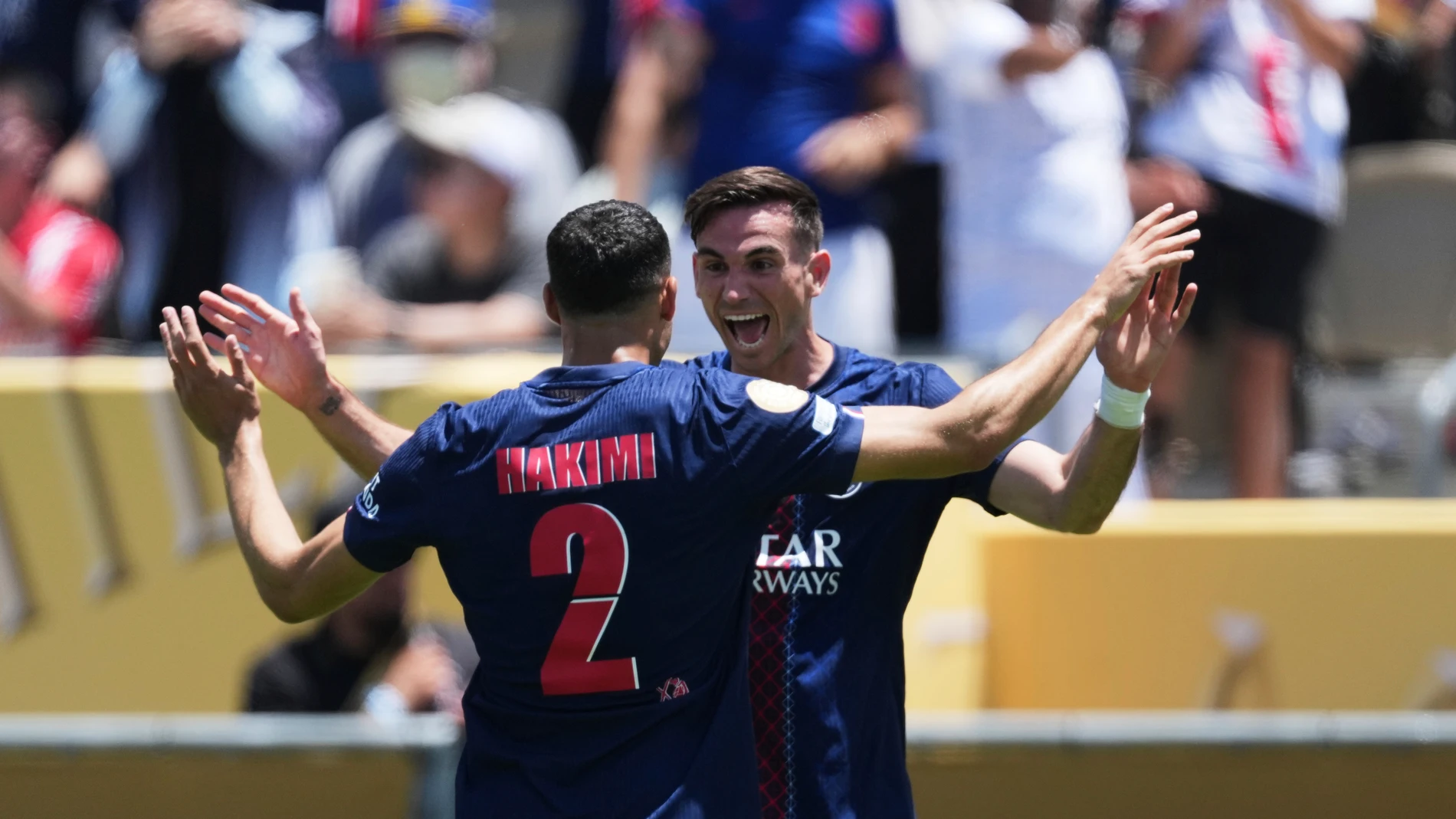 Paris Saint-Germain's Fabian Ruiz, right, celebrates after scoring the opening goal with teammate Achraf Hakimi during the Club World Cup group B soccer match between PSG and Atletico Madrid in Pasadena, Calif., Sunday, June 15, 2025. (AP Photo/Jae Hong)