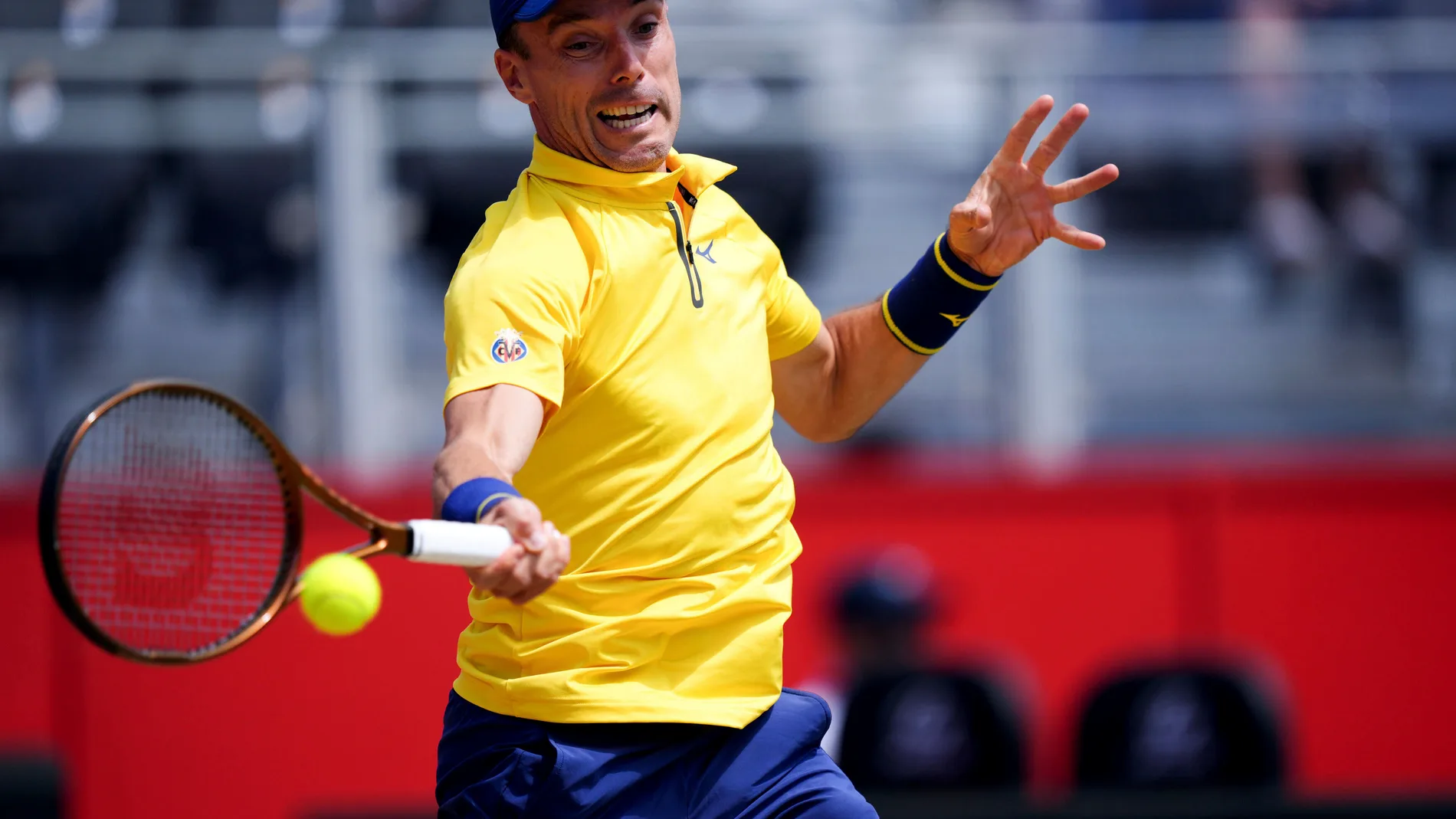 Argentina's Roberto Bautista Agut returns the ball to Czech Republic's Jakub Mensik during the Queen's Club tennis tournament in London, England, Wednesday June 18, 2025. (Ben Whitley/PA via AP)