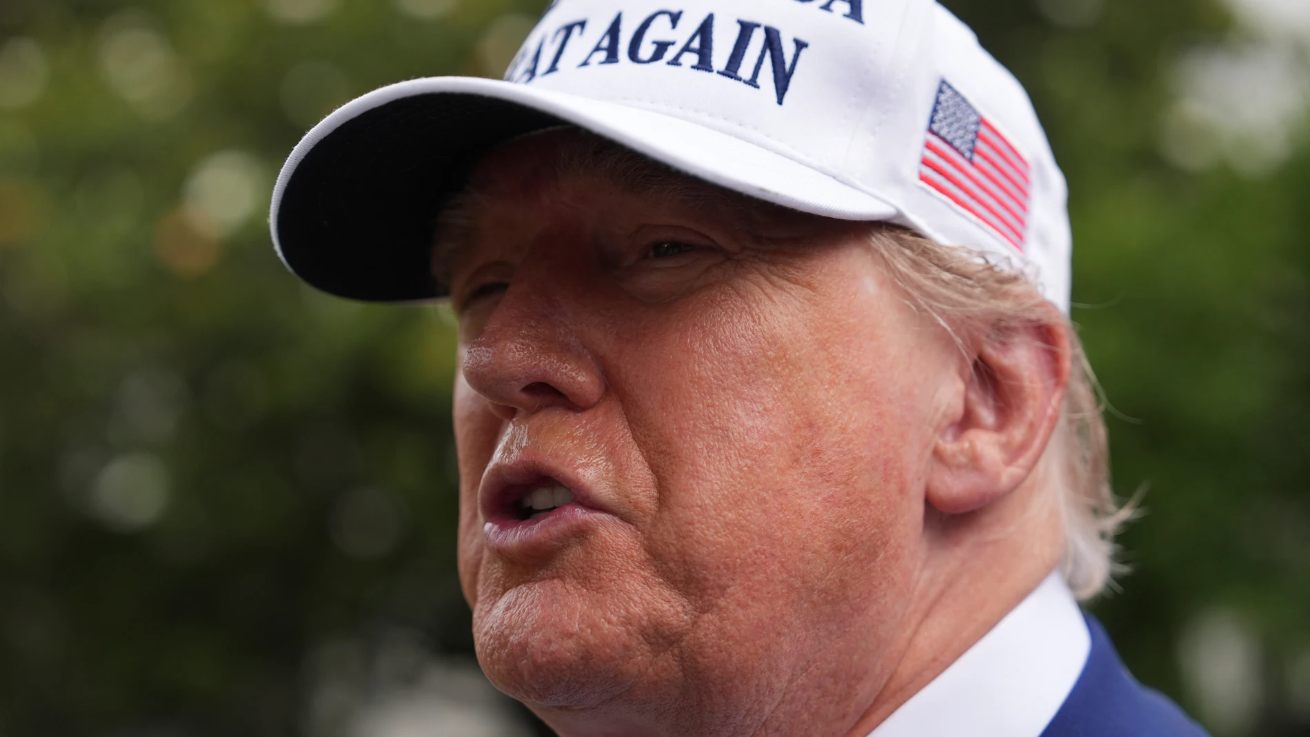 President Donald Trump speaks as a flag pole is installed on the South Lawn of the White House, Wednesday, June 18, 2025, in Washington. (AP Photo/Evan Vucci)