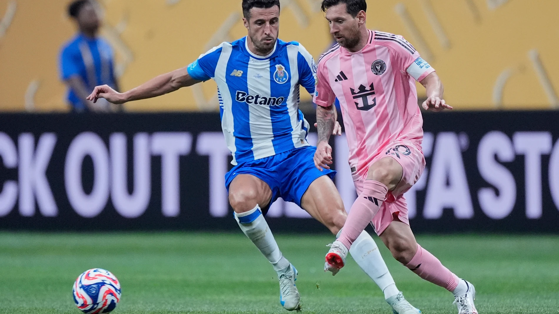 Inter Miami's Lionel Messi passes the ball by Porto's Ivan Marcano during the Club World Cup group A soccer match between Inter Miami and FC Porto in Atlanta, Thursday, June 19, 2025. (AP Photo/Mike Stewart)
