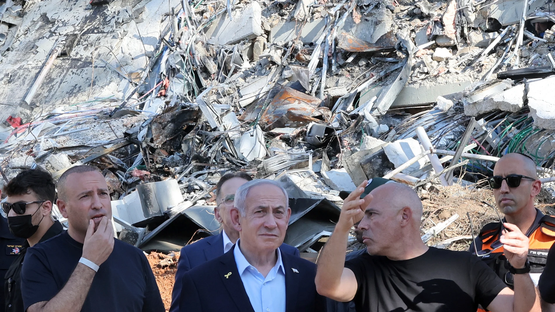Israel's Prime Minister Benjamin Netanyahu visits the site of the Weizmann Institute of Science, which was hit by missiles fired from Iran, in the central city of Rehovot on Friday, June 20, 2025. (Jack Guez/Pool Photo via AP)