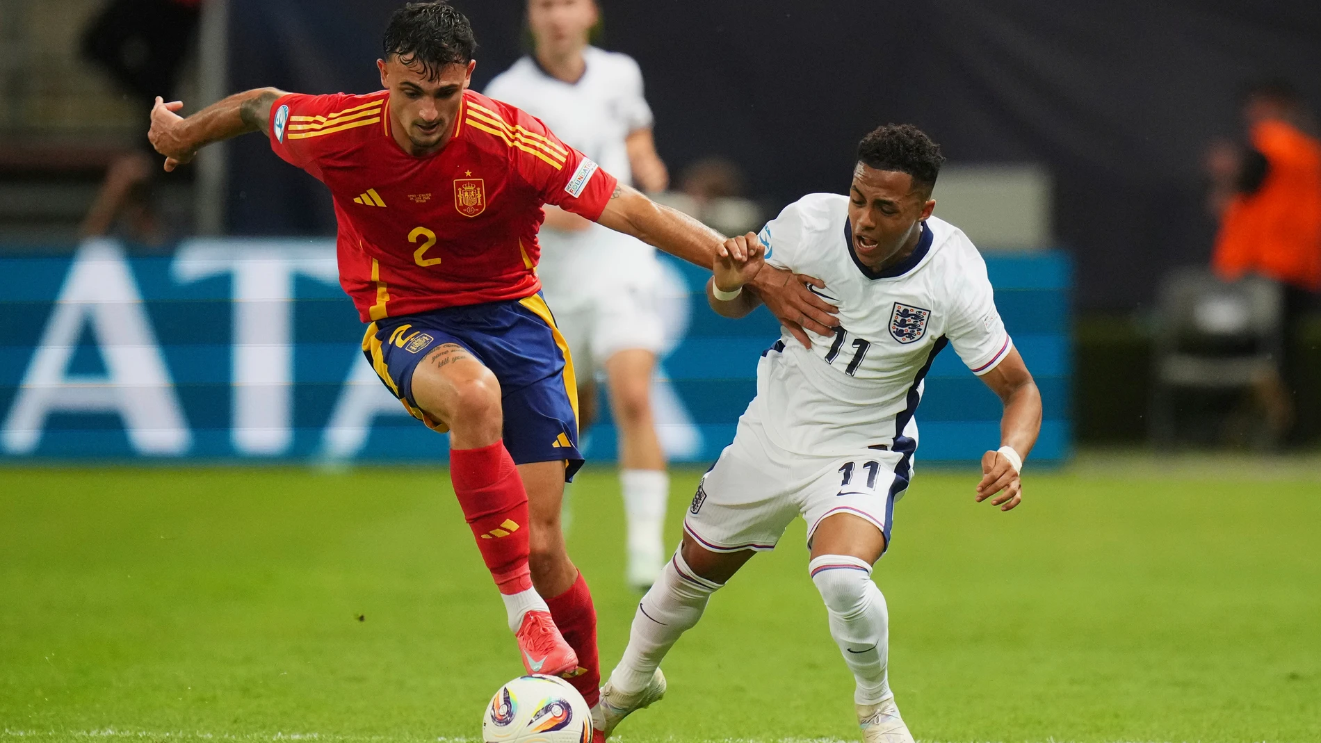 Spain's Marc Pubill, left, duels for the ball with England's Omari Hutchinson during a quarter final soccer match between Spain and England at the European U-21 Championship at the Anton Malatinsky Stadium, in Trnava, Slovakia, Saturday, June 21, 2025. (AP Photo/Petr David Josek)