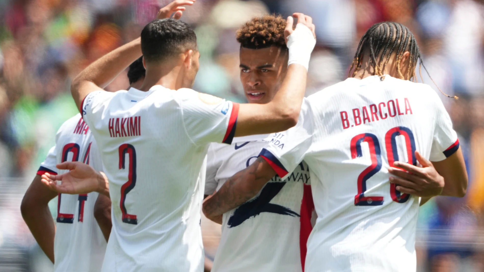 Paris Saint-Germain's Achraf Hakimi is congratulated after scoring his teams second goal during the Club World Cup Group B soccer match between Seattle Sounders and PSG in Seattle, Monday, June 23, 2025. (AP Photo/Lindsey Wasson)