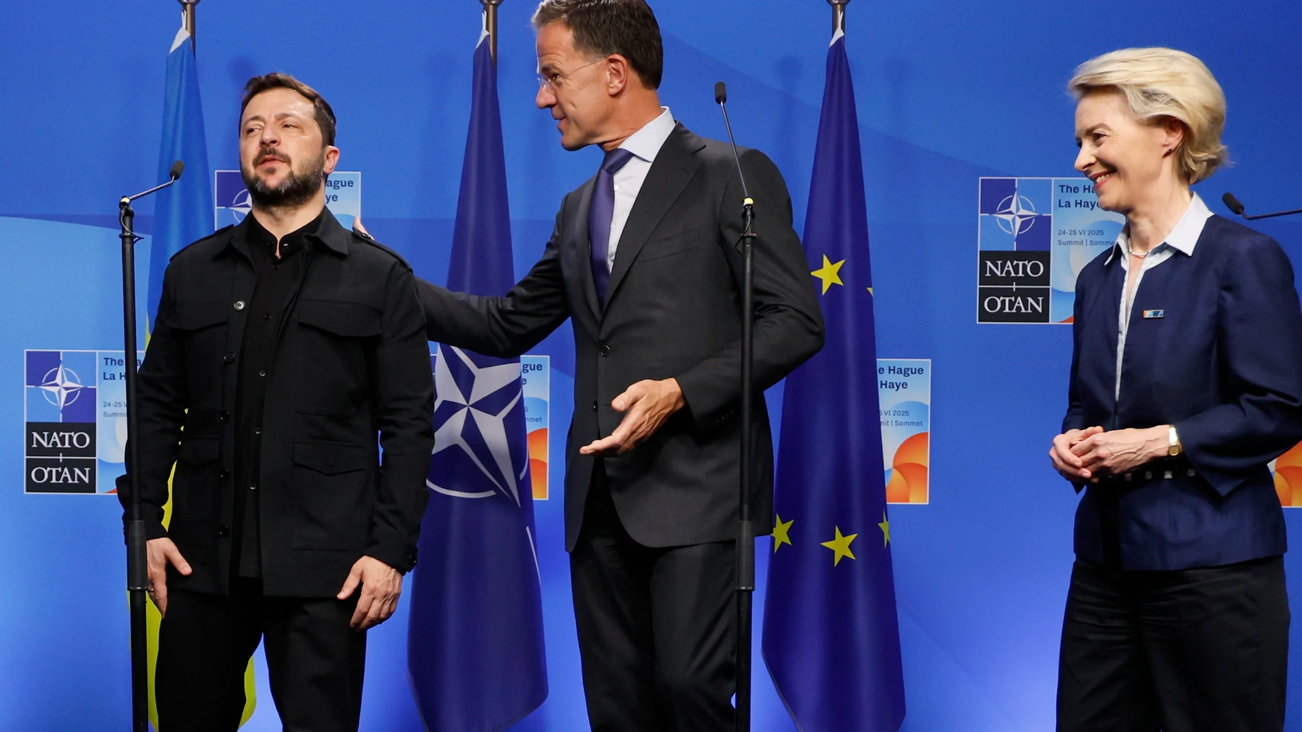 From left, Ukraine's President Volodymyr Zelenskyy, NATO Secretary General Mark Rutte and European Commission President Ursula von der Leyen step off the podium prior to a meeting on the sidelines of the NATO summit in The Hague, Netherlands, Tuesday, June 24, 2025. (AP Photo/Geert Vanden Wijngaert)