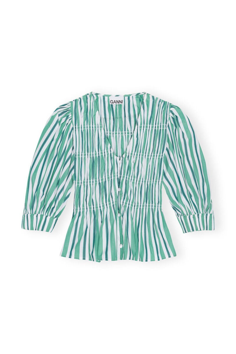 Camisa en verde.