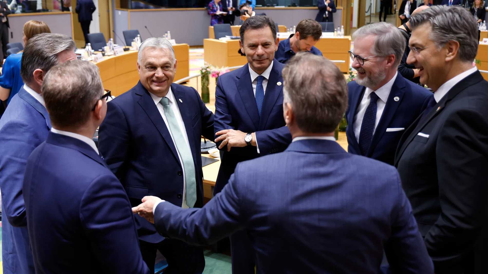 Clockwise from left, Belgium's Prime Minister Bart De Wever, Hungary's Prime Minister Viktor Orban, Portugal's Prime Minister Luis Montenegro, Czech Republic's Prime Minister Petr Fiala, Croatia's Prime Minister Andrej Plenkovic, Slovenia's Prime Minister Robert Golob and Finland's Prime Minister Petteri Orpo attend a round table meeting at an EU summit in Brussels, Thursday, June 26, 2025. (AP Photo/Geert Vanden Wijngaert)