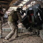 Ukrainian servicemen hold a position in the Donetsk region