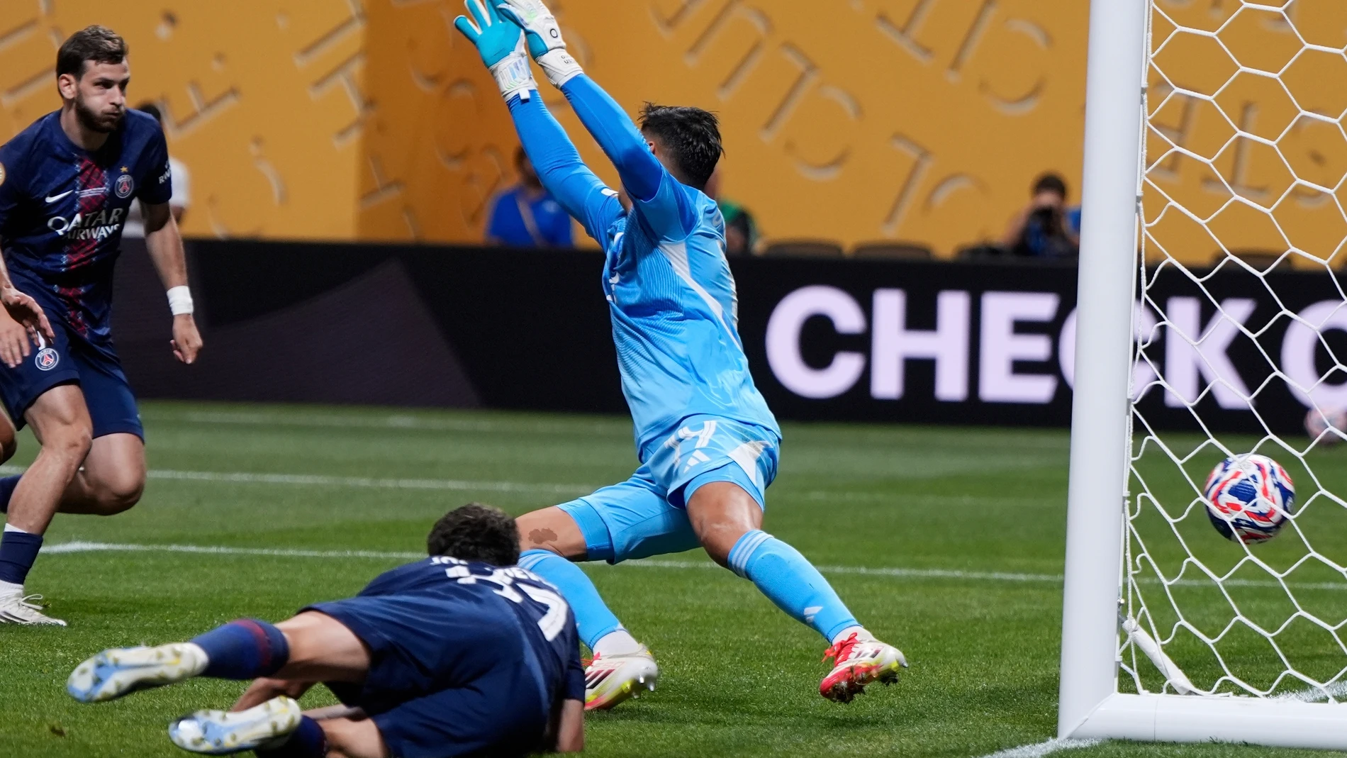 Paris Saint-Germain's Joao Neves, bottom, scores his team's opening goal during the Club World Cup round of 16 soccer match between PSG and Inter Miami in Atlanta, Sunday, June 29, 2025. (AP Photo/Mike Stewart)