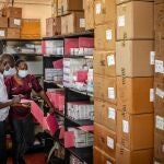 Members of the pharmacology department take inventory of the last boxes of drugs delivered by the now-dismantled United States Agency for International Development (USAID) amid medical supply shortages in a pharmacy storeroom at Lodwar County Referral Hospital in Lodwar on April 1, 2025. 