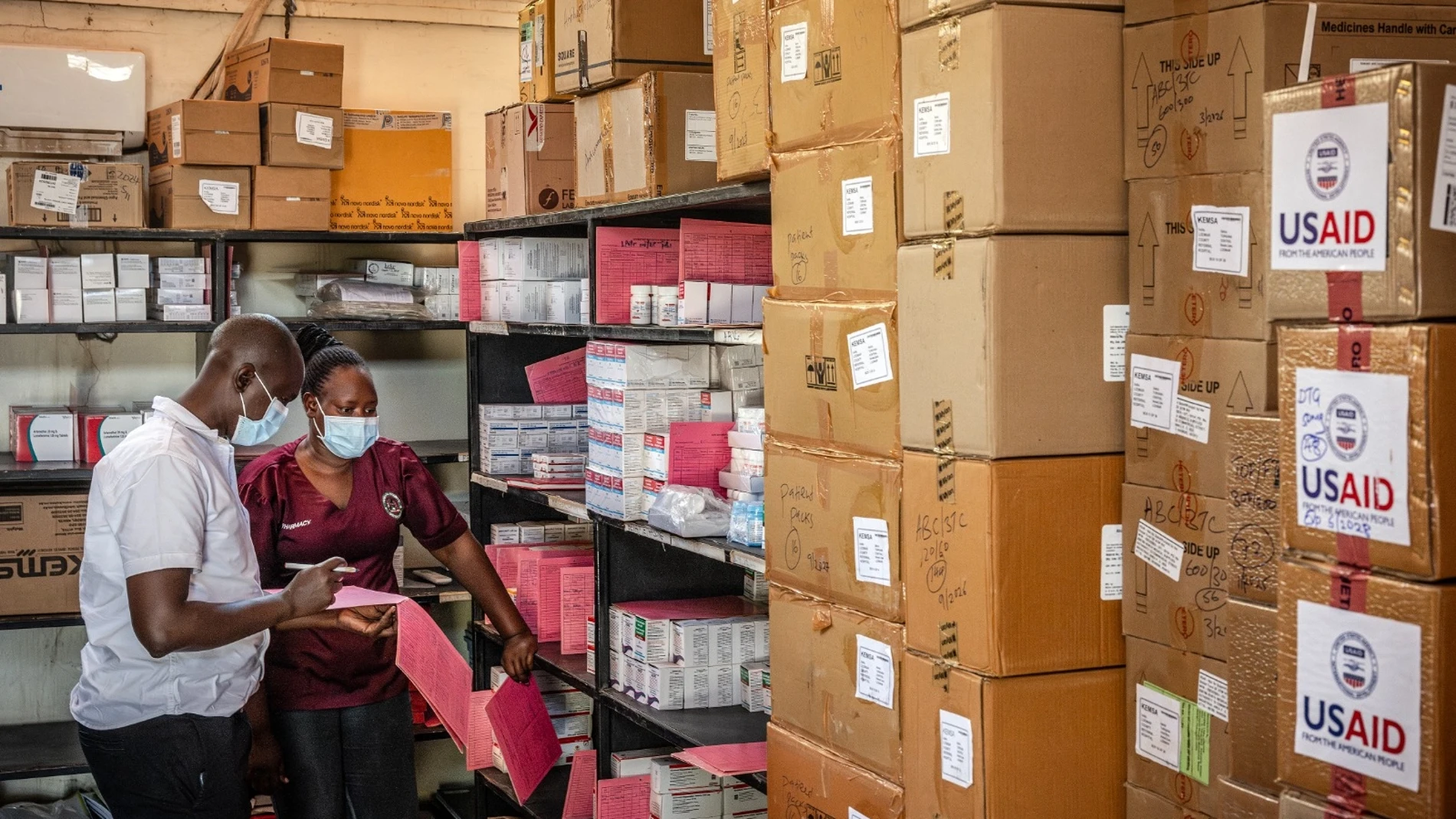 Members of the pharmacology department take inventory of the last boxes of drugs delivered by the now-dismantled United States Agency for International Development (USAID) amid medical supply shortages in a pharmacy storeroom at Lodwar County Referral Hospital in Lodwar on April 1, 2025.