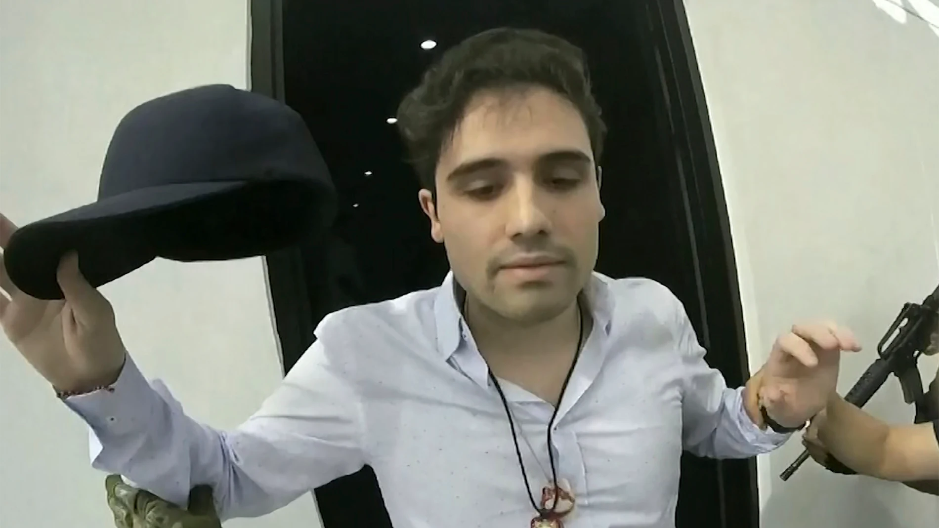 FILE - This frame grab from video, provided by the Mexican government, shows Ovidio Guzman Lopez being detained in Culiacan, Mexico, Oct. 17, 2019. (CEPROPIE via AP File)