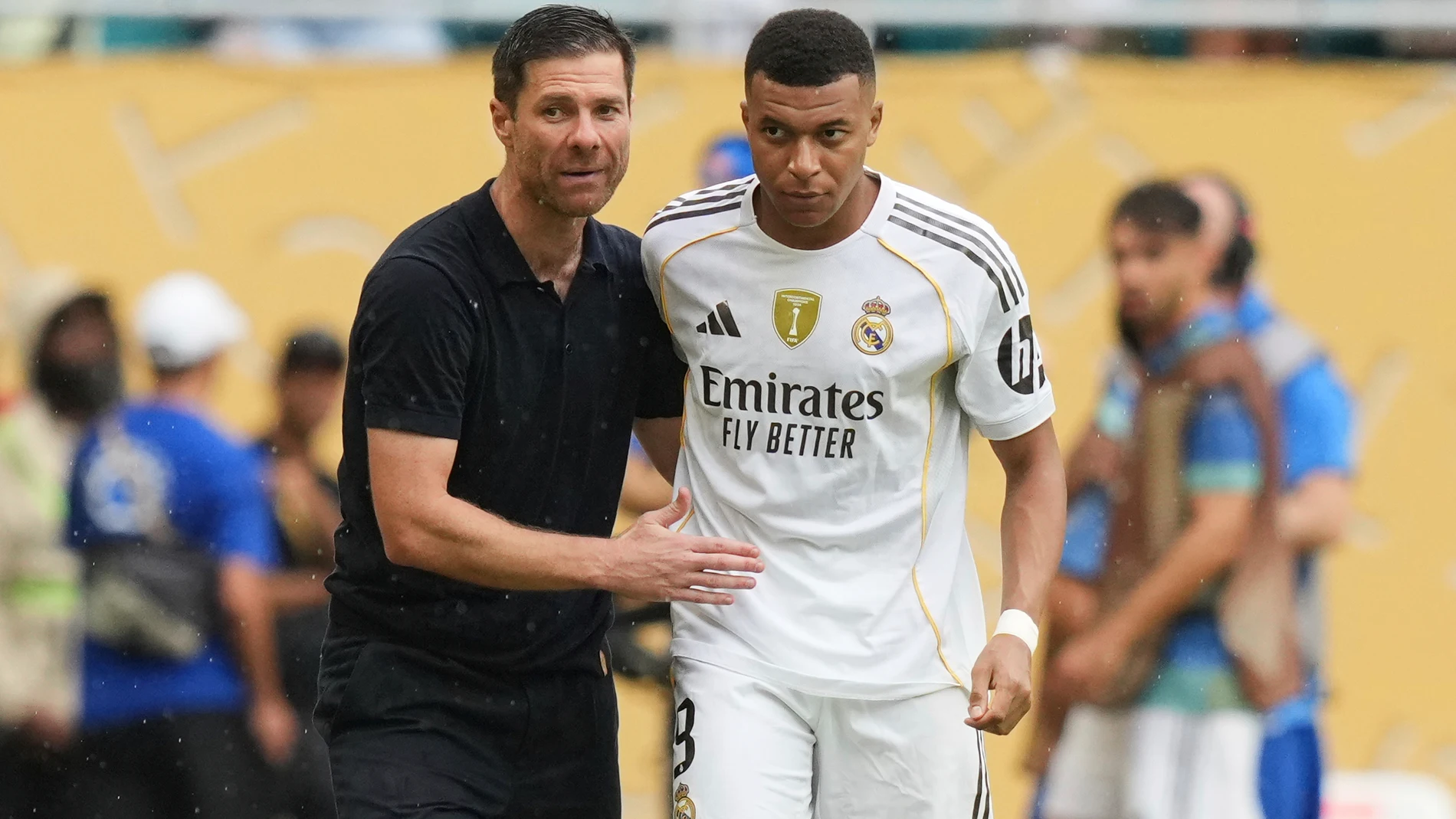Real Madrid manager Xabi Alonso, left, instructs Kylian Mbappe before his substitution during the Club World Cup round of 16 soccer match between Real Madrid and Juventus in Miami Gardens, Fla., Tuesday, July 1, 2025. (AP Photo/Lynne Sladky)