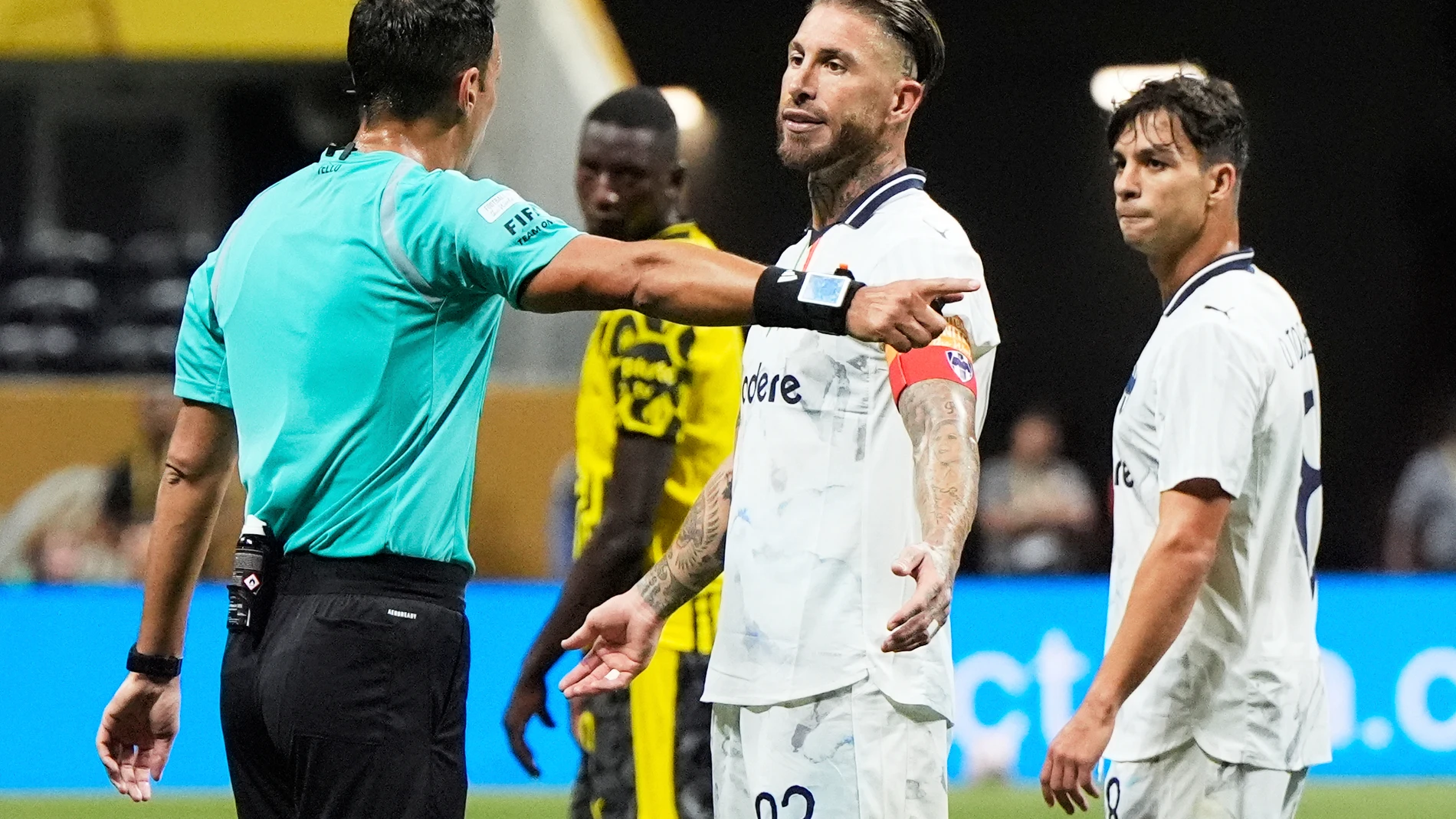 Monterrey's Sergio Ramos reacts as he speaks to referee Facundo Tello, left, during the Club World Cup round of 16 soccer match between Borussia Dortmund and CF Monterrey in Atlanta, Tuesday, July 1, 2025. (AP Photo/Mike Stewart)