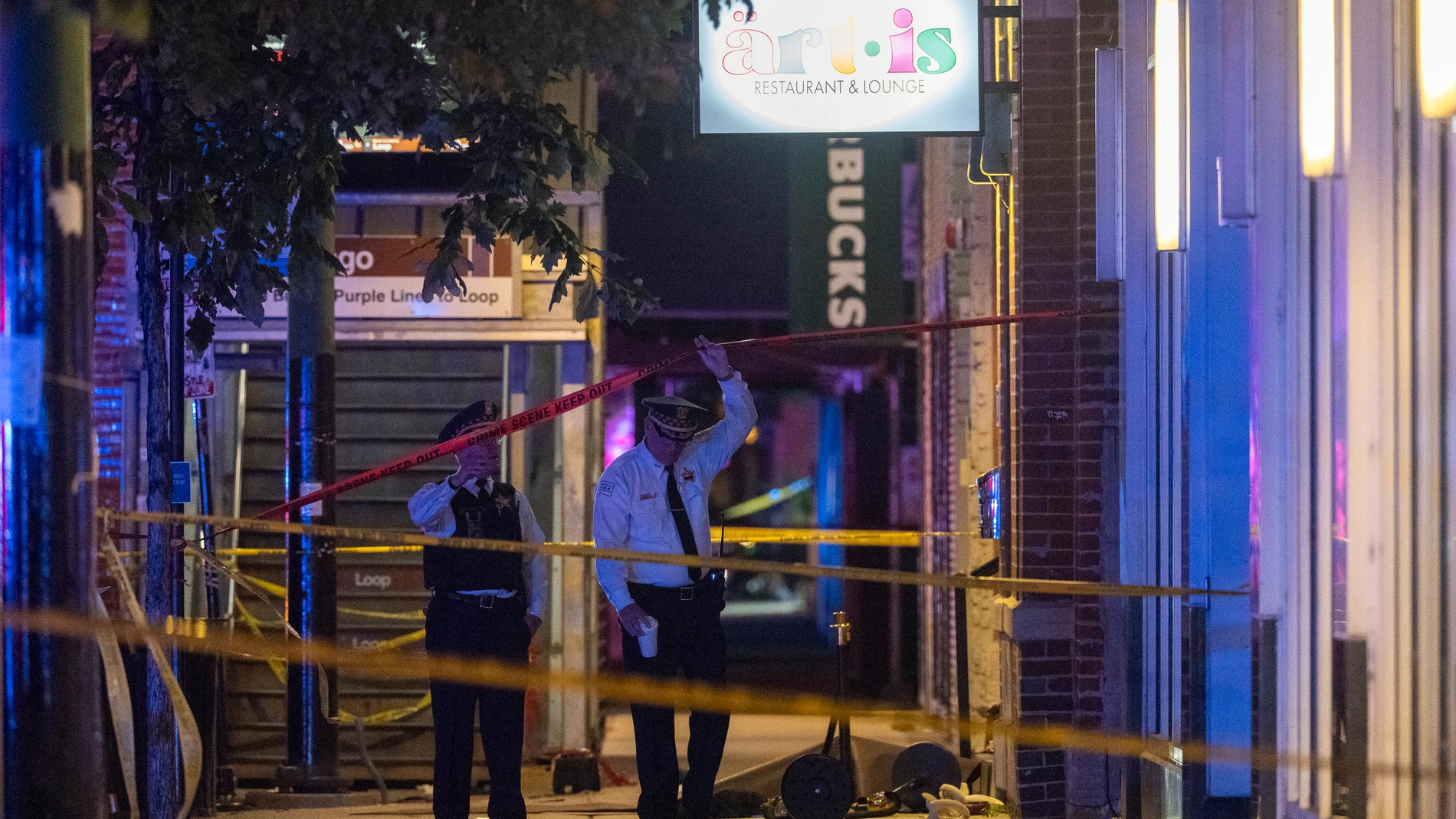 Chicago police investigate the scene of a shooting that took place at Artis Restaurant and Lounge located near Chicago Avenue in the River North neighborhood, Thursday, July 3, 2025. (Tyler Pasciak LaRiviere/Chicago Sun-Times via AP)