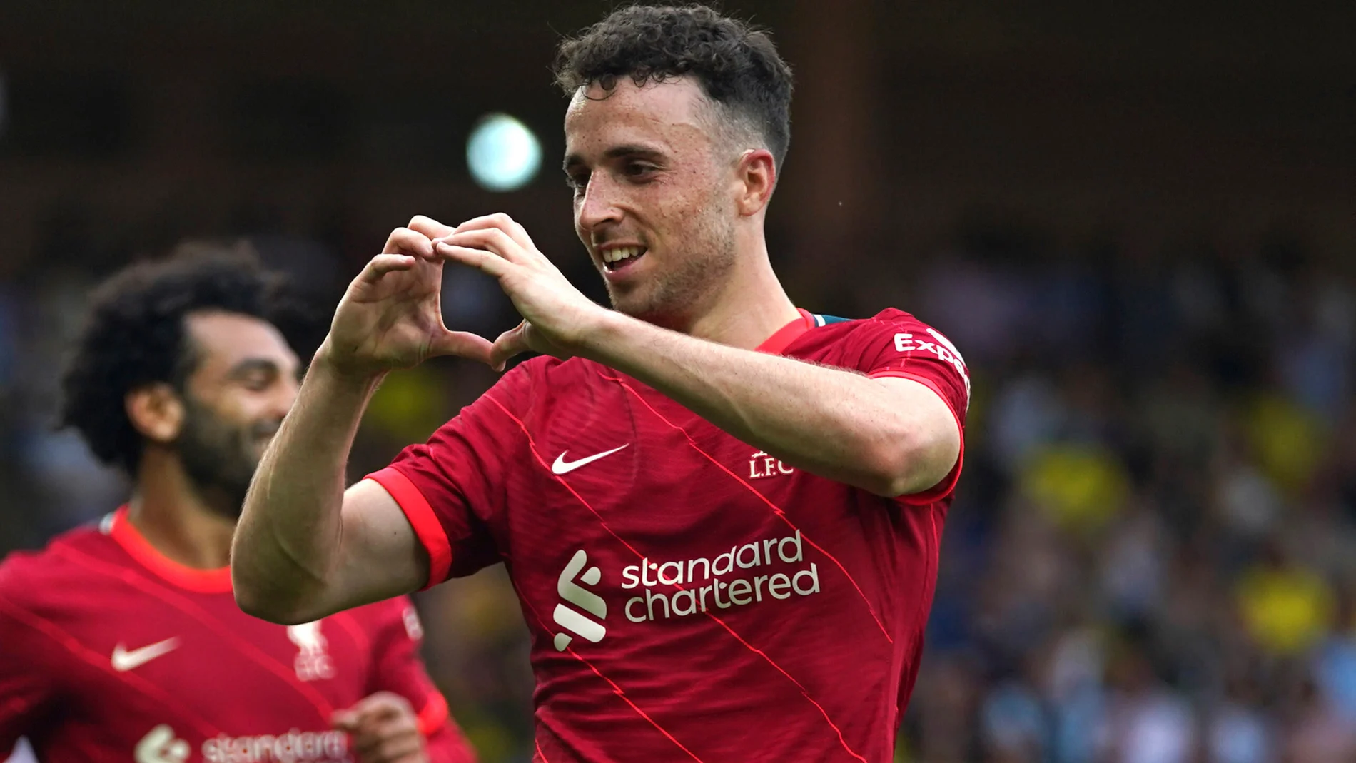 FILE - Liverpool's Diogo Jota celebrates scoring during the Premier League match at Carrow Road, Norwich, Saturday Aug. 14, 2021. (Joe Giddens/PA via AP, File)