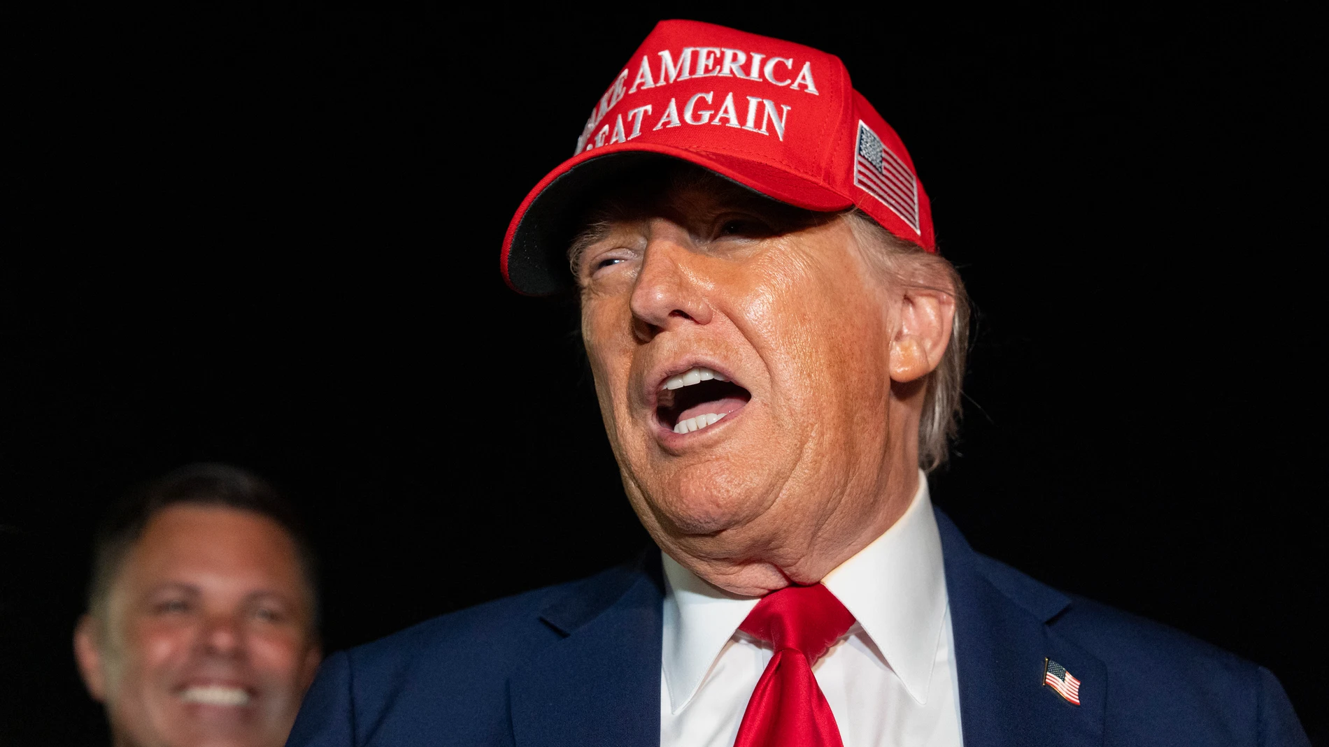 President Donald Trump speaks with reporters as he arrives on Air Force One, Friday, July 4, 2025, at Joint Base Andrews, Md. (AP Photo/Alex Brandon)