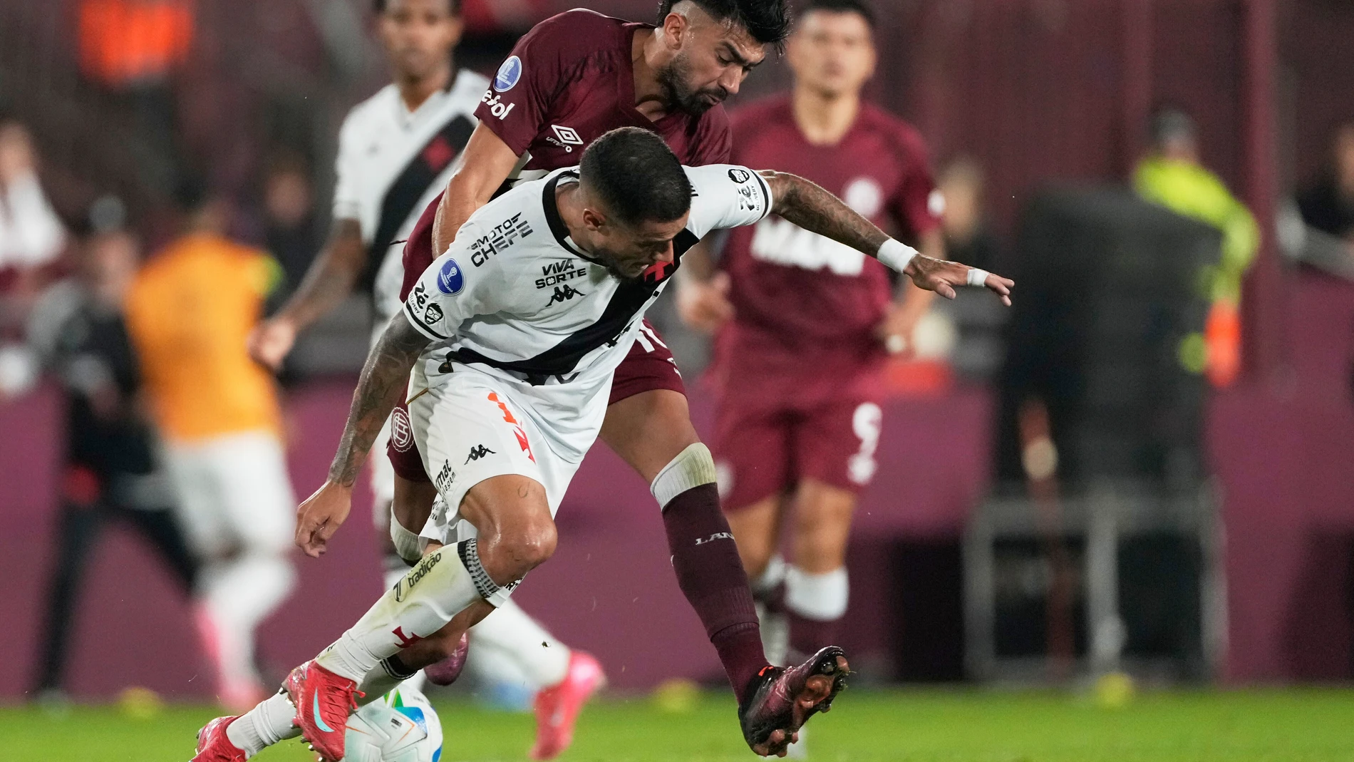 FILE - Philippe Coutinho of Brazil's Vasco da Gama, front, and Damian Moreno of Argentina's Lanus battle for the ball during a Copa Sudamericana Group G soccer match at Nestor Diaz Perez stadium in Buenos Aires, Argentina, Tuesday, May 13, 2025. (AP Photo/Gustavo Garello, File)