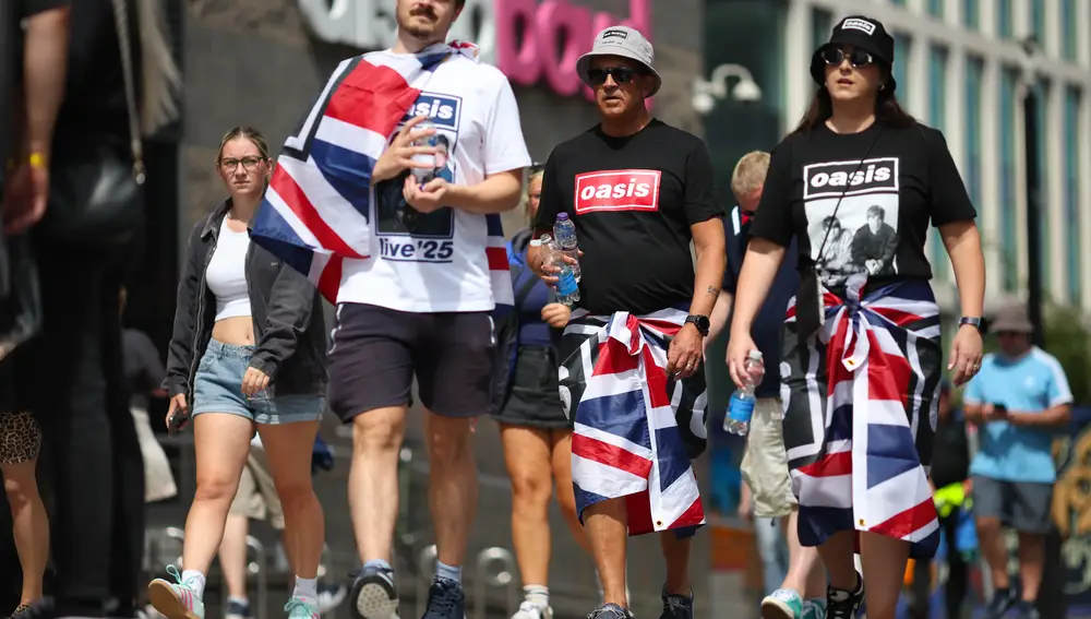 Fans arrive for the first Oasis gig since the band reunited