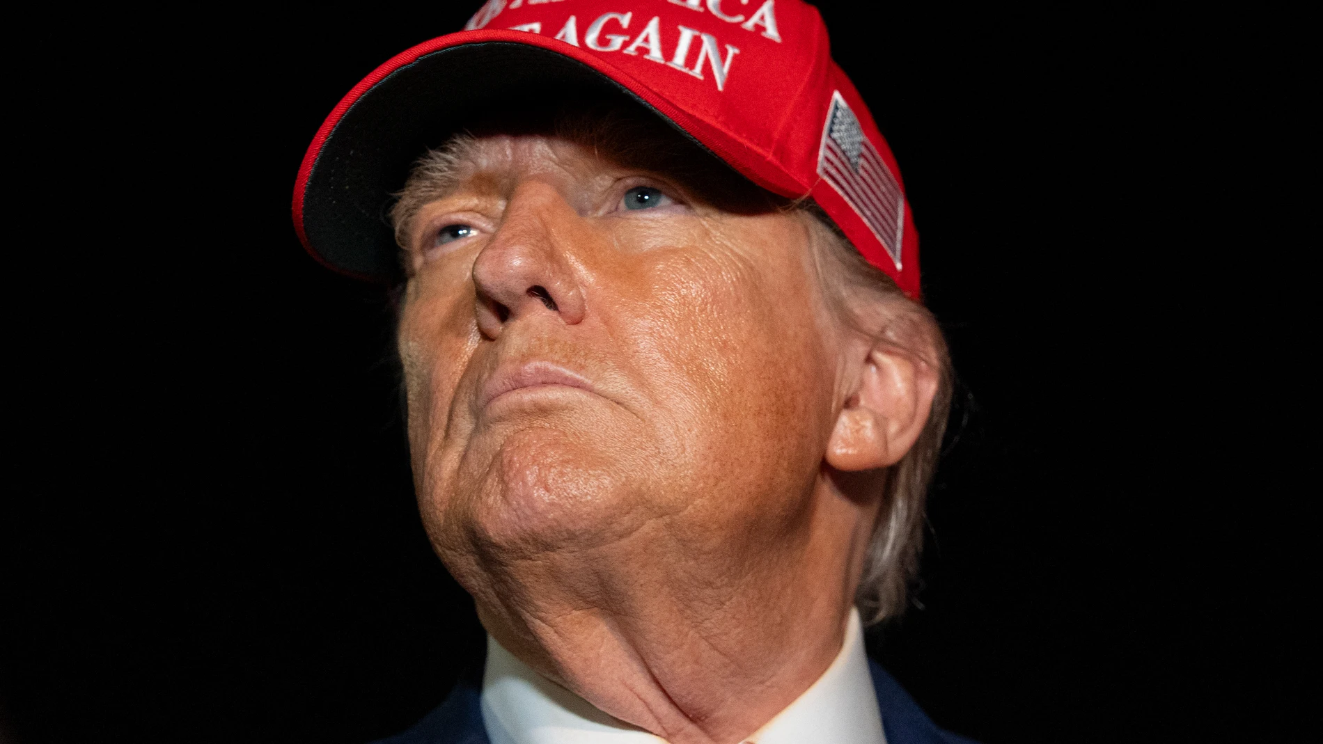 President Donald Trump speaks with reporters as he arrives on Air Force One, Friday, July 4, 2025, at Joint Base Andrews, Md. (AP Photo/Alex Brandon)