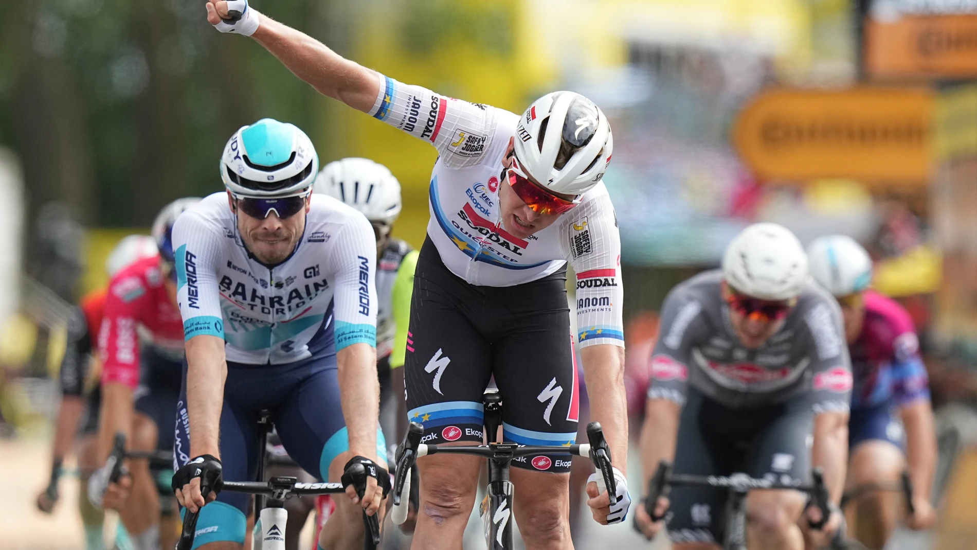 Belgium's Tim Merlier celebrates as he crosses the finish line to win the third stage of the Tour de France cycling race over 178.3 kilometers (110.8 miles) with start in Valenciennes and finish in Dunkerque, France, Monday, July 7, 2025. (AP Photo/Thibault Camus)