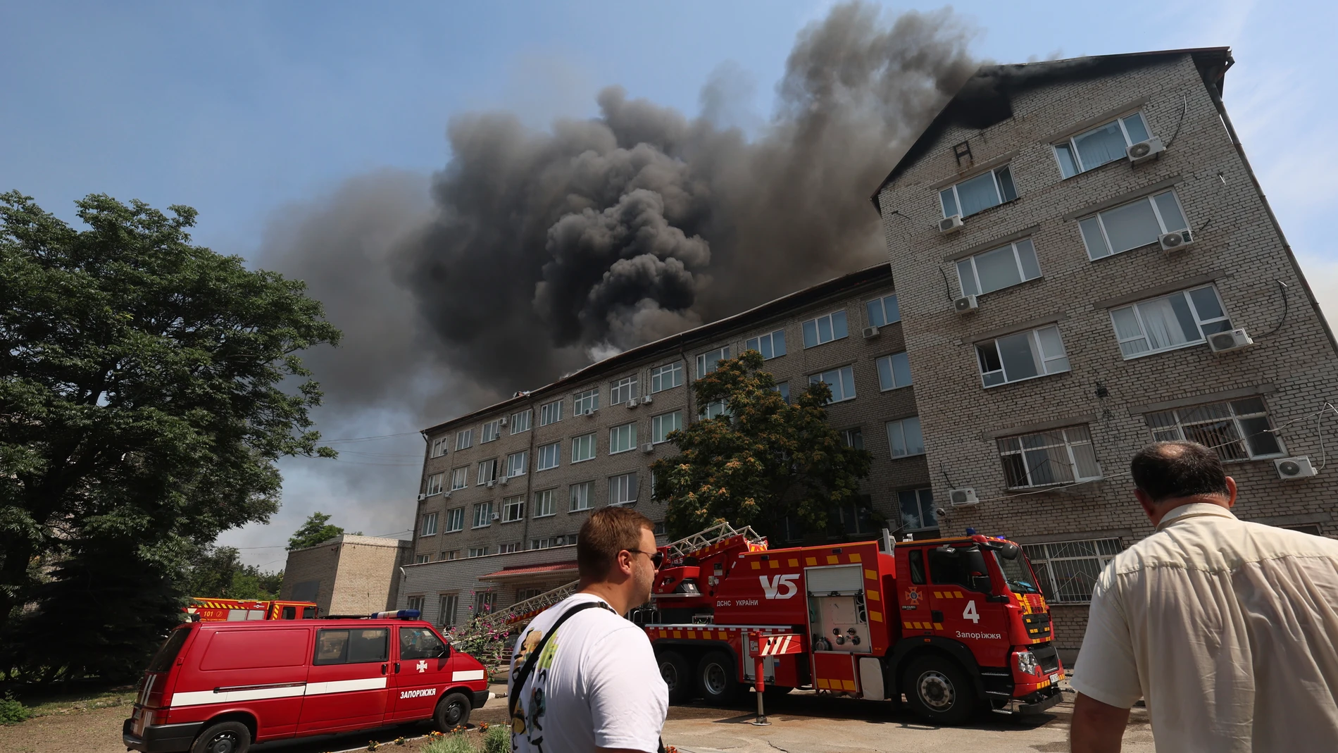 Rescue workers put out a fire of a building destroyed by a Russian drone strike in Zaporizhzhia, Ukraine, on Monday, July 7, 2025. (AP Photo/Kateryna Klochko)