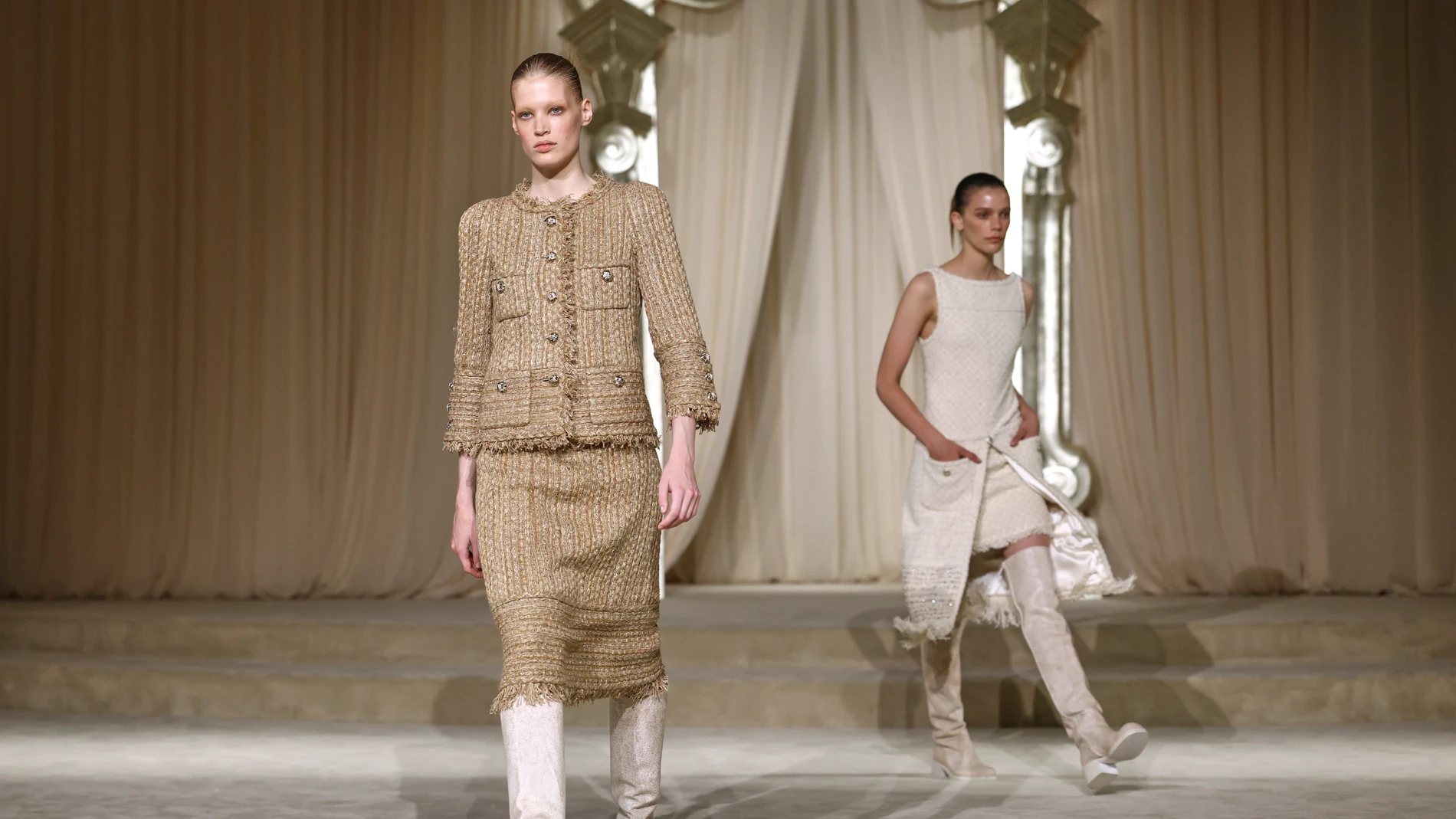 Models wear creations as part of the Chanel Fall-Winter 2025/26 Haute Couture collection presented Tuesday, July 8, 2025, in Paris. (AP Photo/Tom Nicholson)
