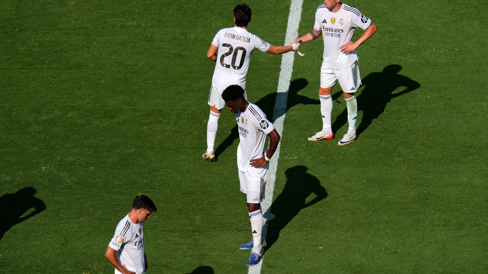 Real Madrid players react after the team's loss in the Club World Cup semifinal soccer match between PSG and Real Madrid in East Rutherford, N.J., Wednesday, July 9, 2025. (AP Photo/Pamela Smith)