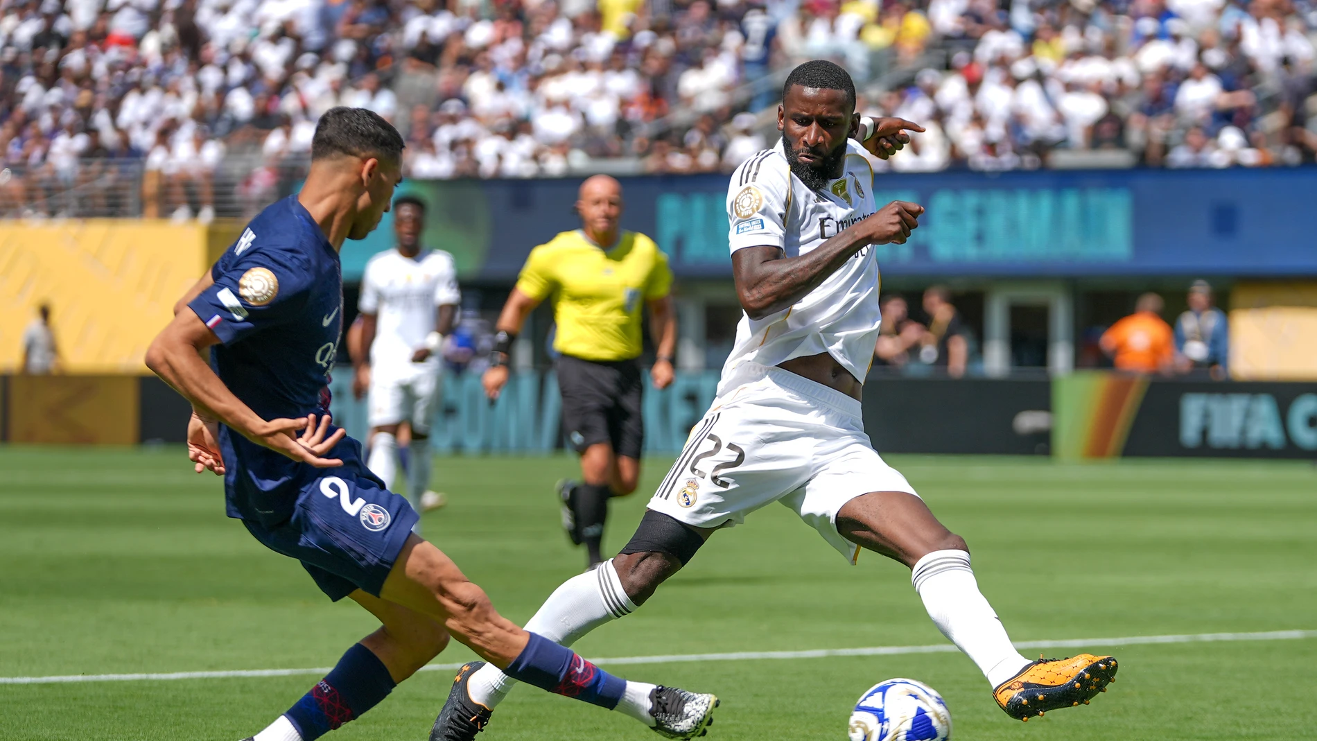 Paris Saint-Germain's Achraf Hakimi passes the ball against Real Madrid's Antonio Rudiger during the first half of a Club World Cup semifinal soccer match in East Rutherford, N.J., Wednesday, July 9, 2025. (AP Photo/Frank Franklin II)