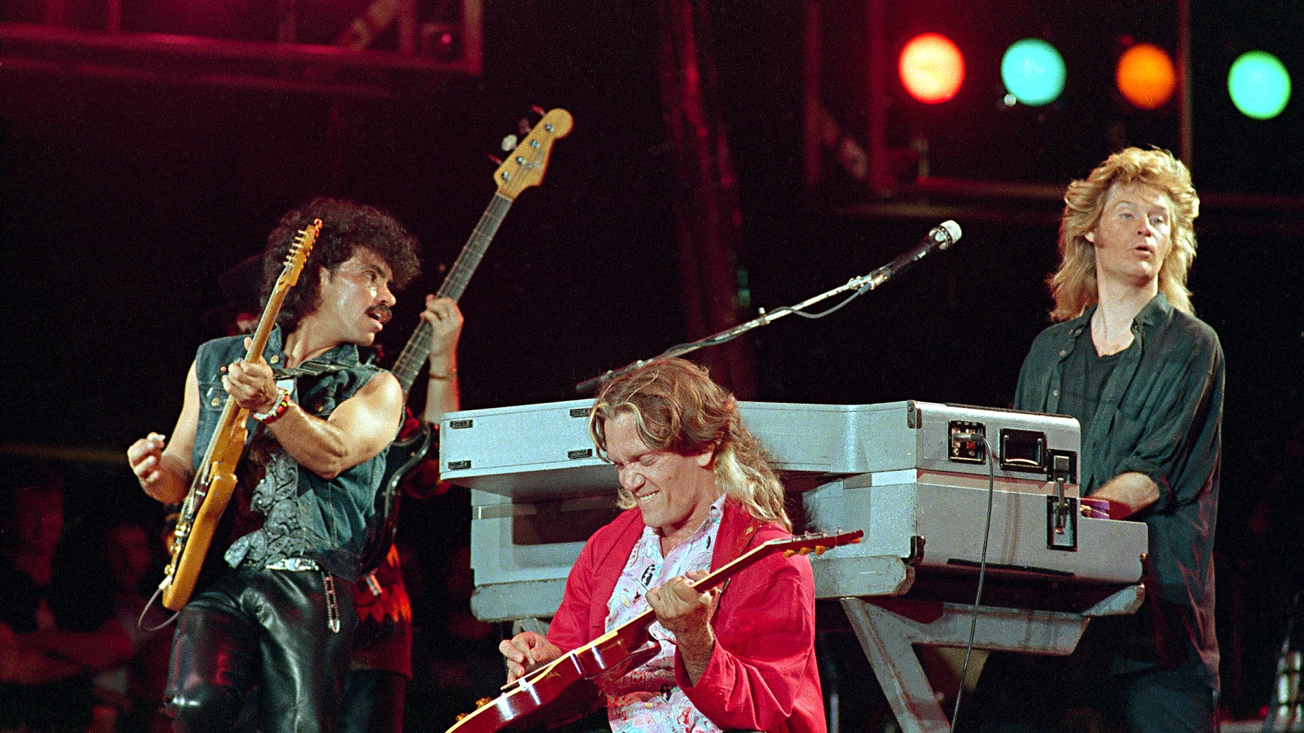 FILE - John Oates, from left, G.E.Smith and Daryl Hall perform at JFK Stadium in Philadelphia for the Live Aid famine relief concert on July 13, 1985. (AP Photo/Amy Sancetta, File)