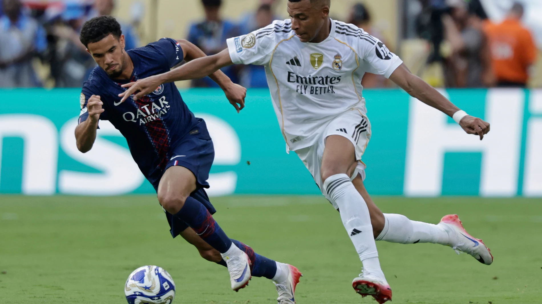 Paris Saint-Germain's Marquinhos, left, and Real Madrid's Kylian Mbappe challenge for the ball during the Club World Cup semifinal soccer match between PSG and Real Madrid in East Rutherford, N.J., Wednesday, July 9, 2025. (AP Photo/Adam Hunger)