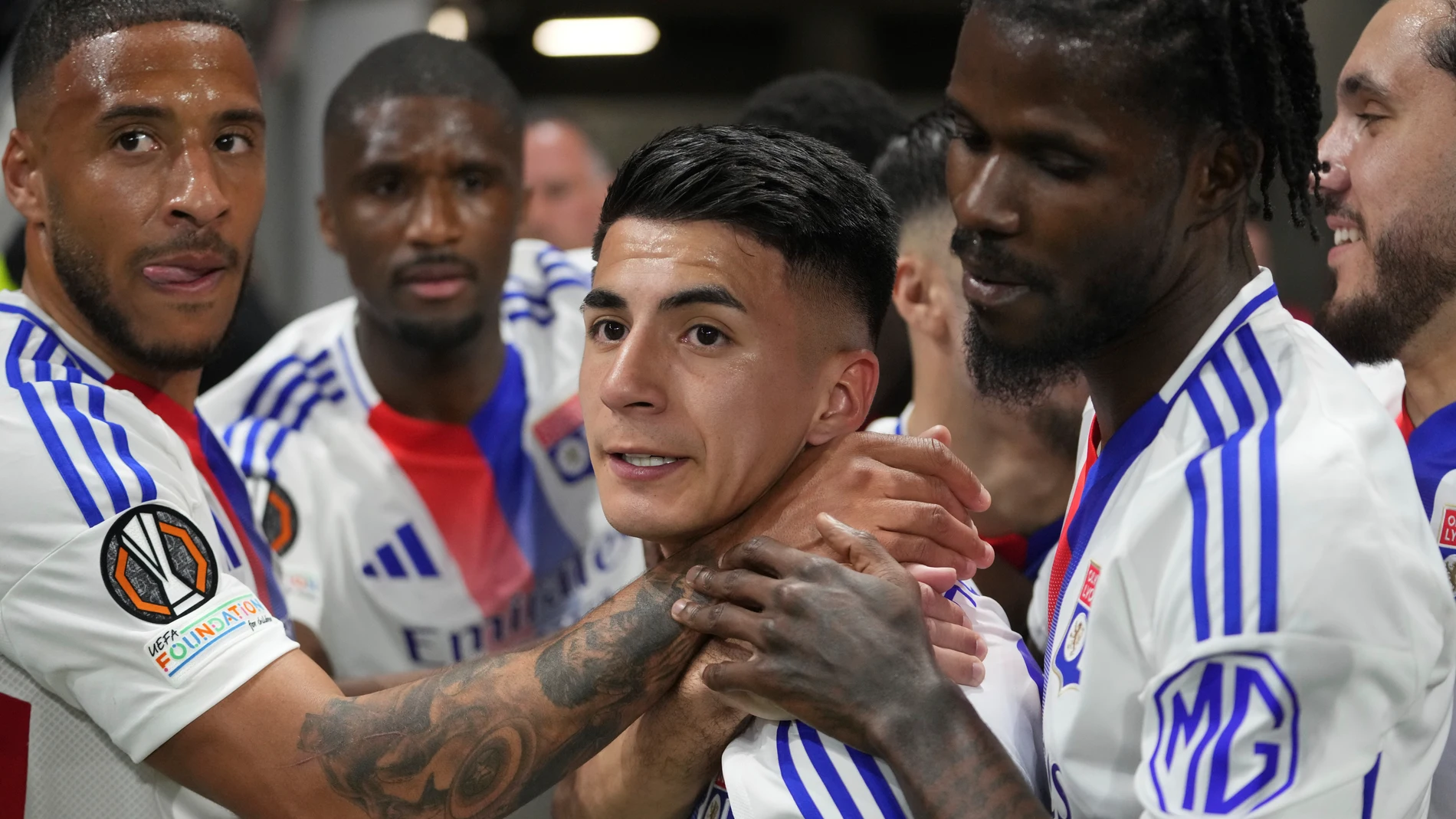 FILE - Lyon's Thiago Almada, centre, celebrates with teammates after scoring the opening goal during the Europa League quarterfinal first leg soccer match between Lyon and Manchester United at Groupama stadium in Decines, outside Lyon, France, April 10, 2025. (AP Photo/Thibault Camus, File)