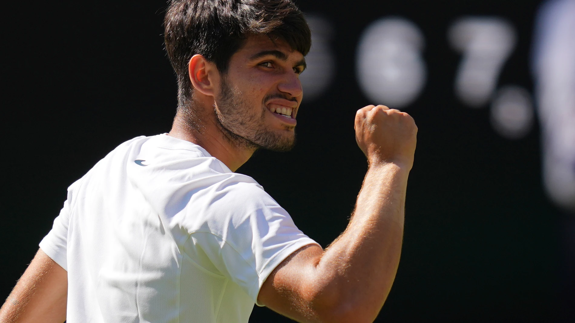 Carlos Alcaraz of Spain celebrates winning the men's semifinal singles match against Taylor Fritz of the U.S. at the Wimbledon Tennis Championships in London, Friday, July 11, 2025.(AP Photo/Kirsty Wigglesworth)