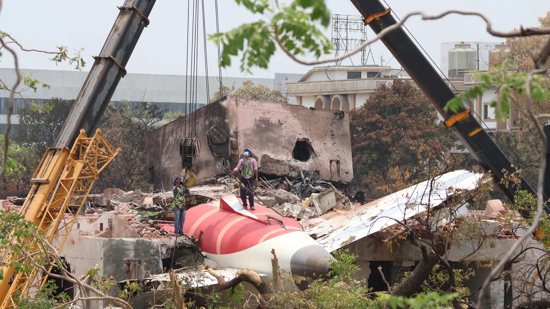 June 14, 2025, Ahmedabad, Gujrat, India: A crane retrieves part of the fuselage of the Air India Boeing 787 on June 14, 2025 in Ahmedabad, India. An Air India Boeing 787 Dreamliner, flight AI-171, carrying 242 passengers and crew members en route from Ahmedabad to London Gatwick, crashed shortly after takeoff on June 12, 2025, after the pilot issued a mayday call to air traffic control. The aircraft crashed into the densely populated Meghani Nagar area near Sardar Vallabhbhai Patel Internatio...