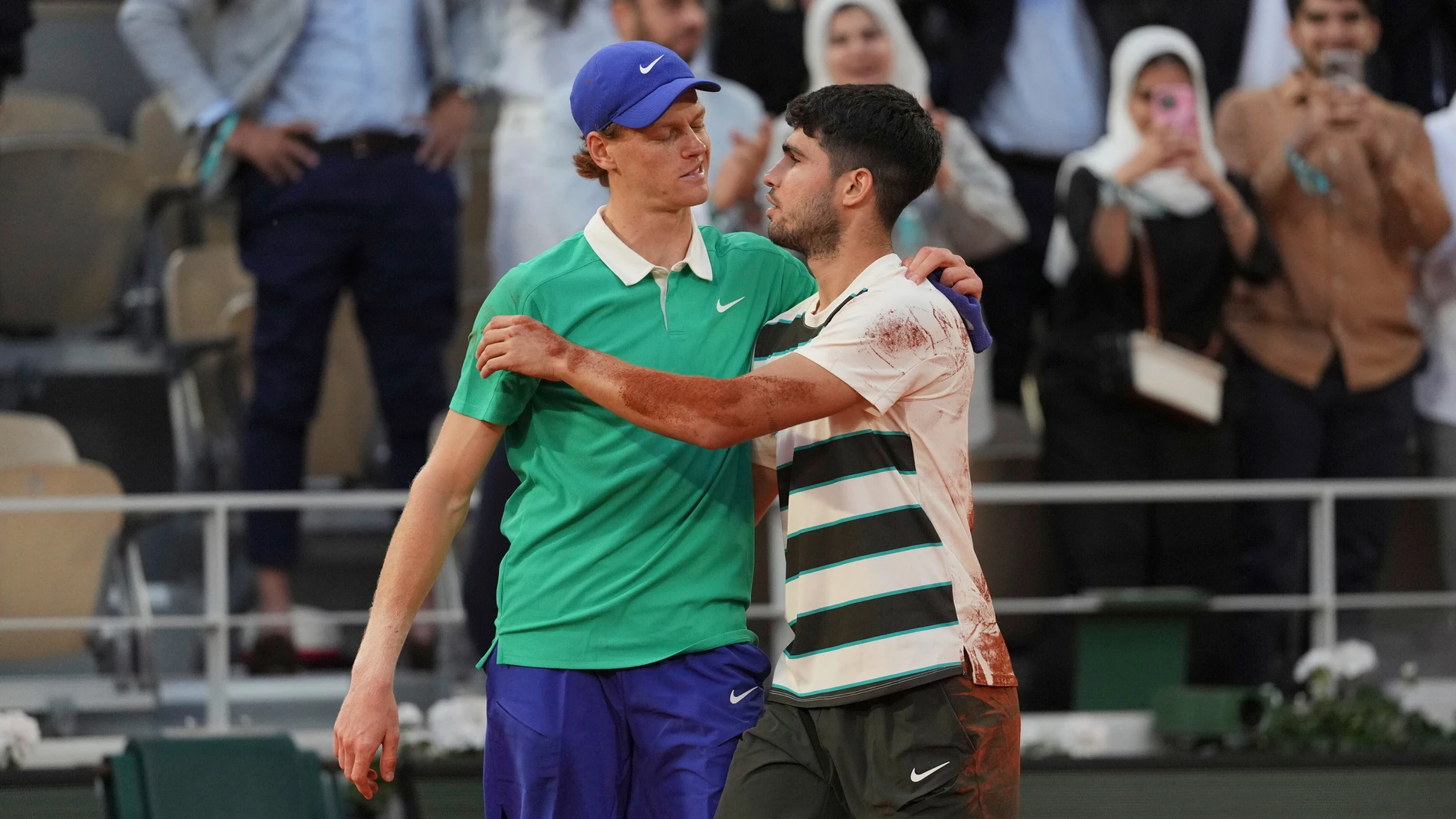 FILE - Winner Spain's Carlos Alcaraz, right, and Italy's Jannik Sinner hug after the final match of the French Open tennis tournament at the Roland-Garros stadium in Paris, June 8, 2025. (AP Photo/Thibault Camus, File)
