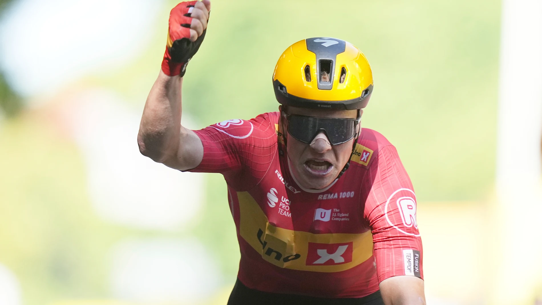 Norway's Jonas Abrahamsen celebrates as he crosses the finish line to win the eleventh stage of the Tour de France cycling race over 156.8 kilometers (97.4 miles) with start and finish in Toulouse, France, Wednesday, July 16, 2025. (AP Photo/Thibault Camus)