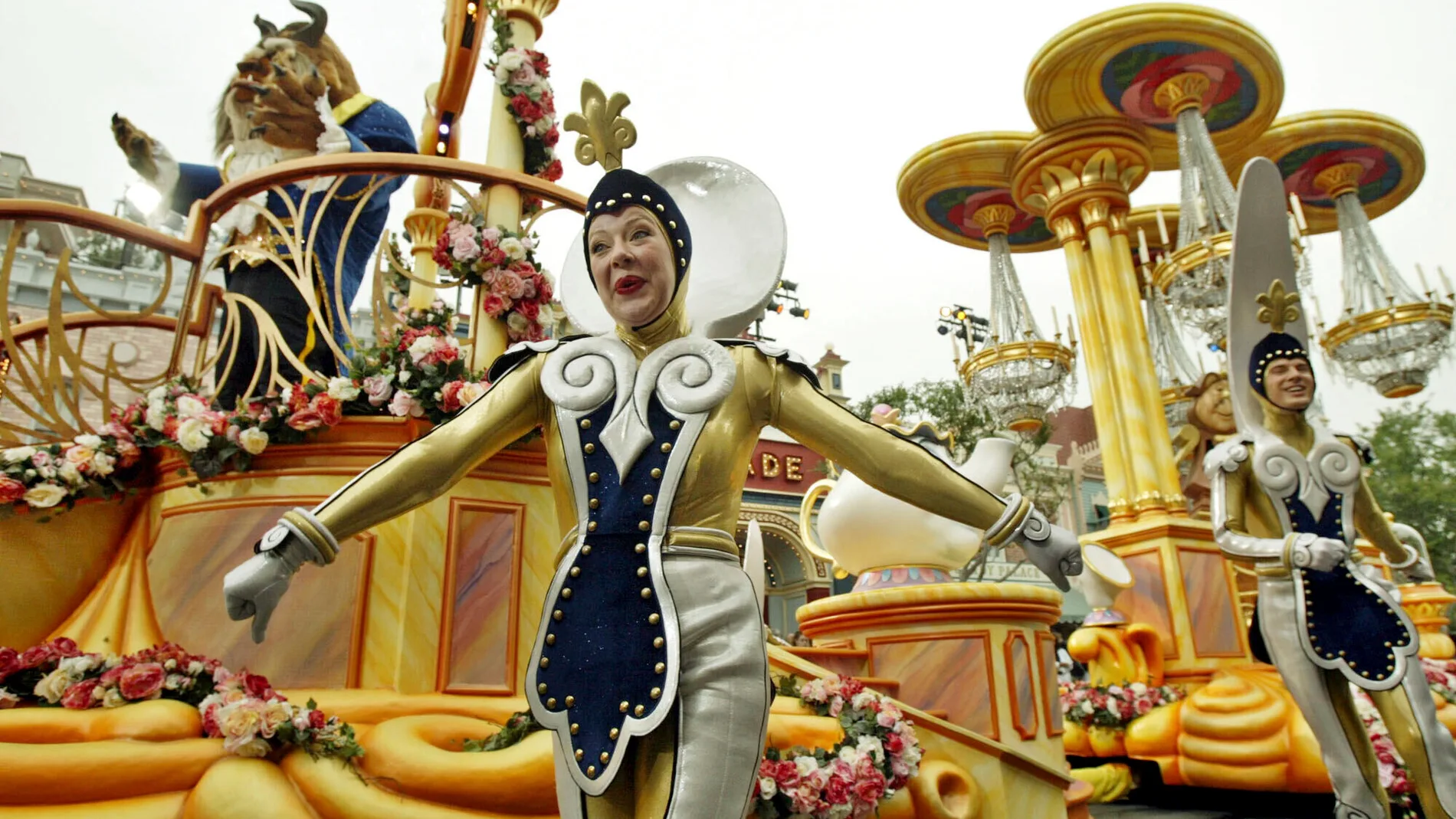 FILE - The "Beauty and the Beast" float, along with supporting characters, entertains visitors to Disneyland during "Walt Disney's Parade of Dreams" in Anaheim, Calif., May 4, 2005. (AP Photo/Ric Francis, File)