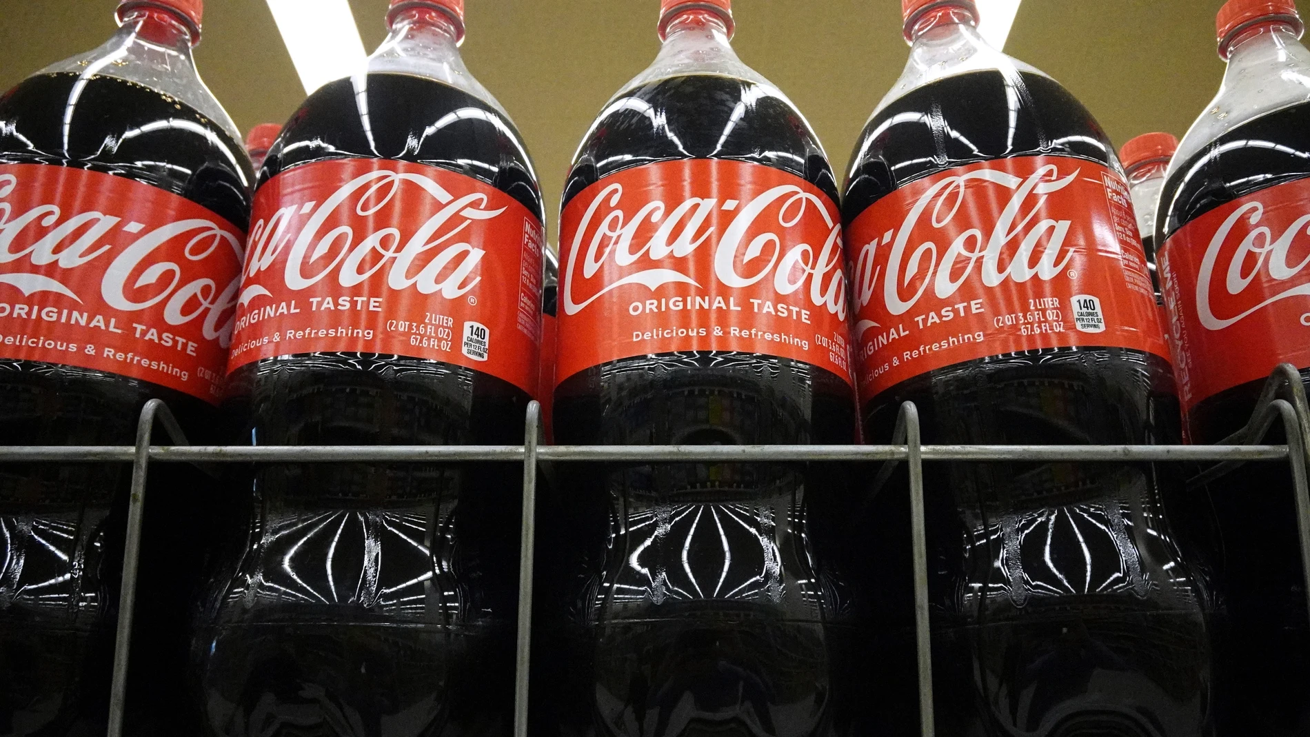 Bottles of Coca-Cola are displayed at a grocery store in Mount Prospect, Ill., Thursday, July 17, 2025. (AP Photo/Nam Y. Huh)
