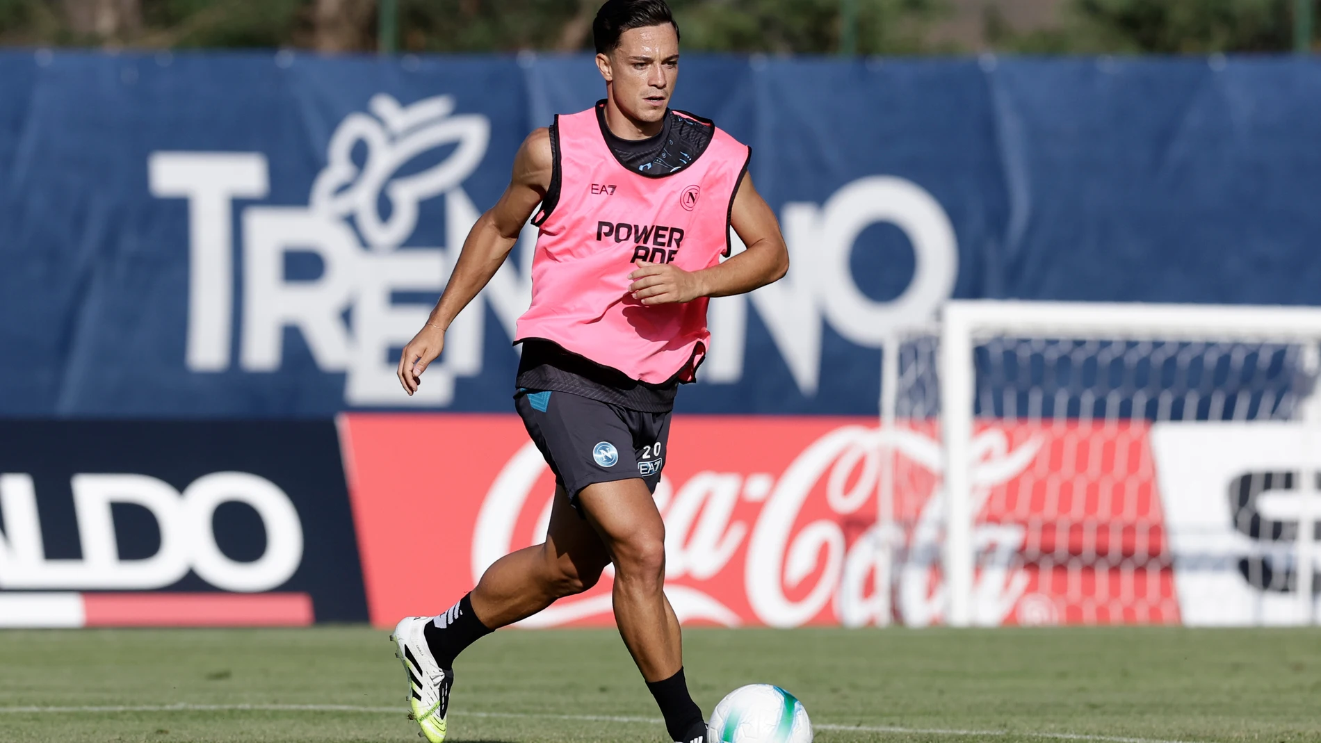 Napoli's Giacomo Raspadori dribbles during a soccer training session in Dimaro, Italy, Friday, July 18, 2025. (Alessandro Garofalo/LaPresse via AP)
