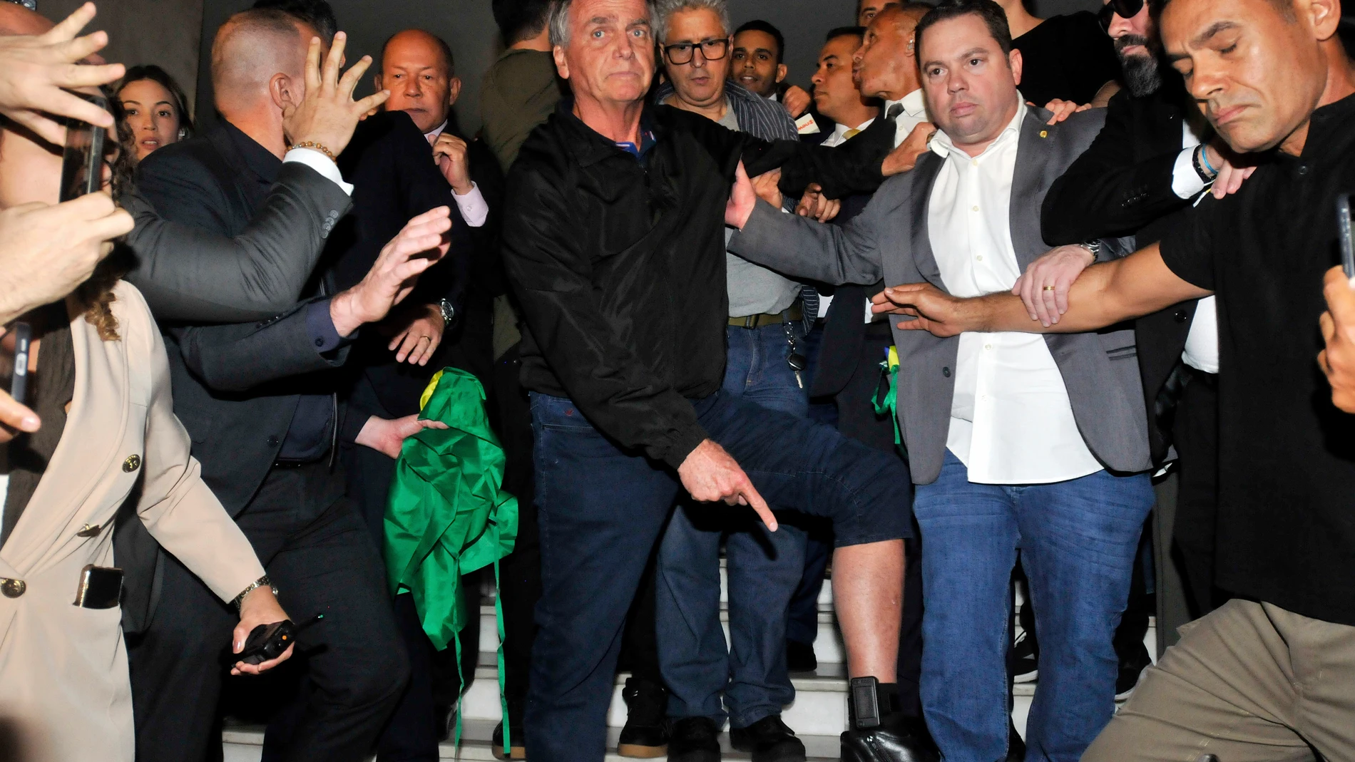Brazil's former President Jair Bolsonaro shows an electronic ankle monitor that the Supreme Court ordered him to wear, at Congress in Brasília, Brazil, Monday, July 21, 2025. (AP Photo/Minervino Junior, CB/D.A Press)