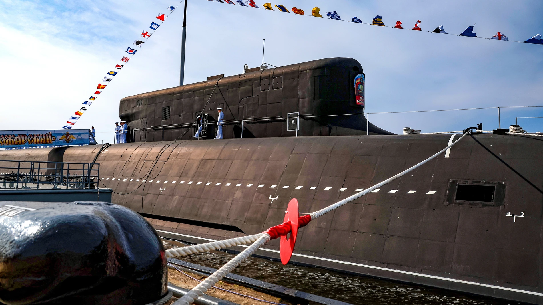 The Knyaz Pozharsky nuclear-powered Borei-A class submarine is moored at the pier prior to a flag raising ceremony with the participation of Russian President Vladimir Putin in Severodvinsk, Russia, Thursday, July 24, 2025. (Alexander Kazakov, Sputnik, Kremlin Pool Photo via AP)