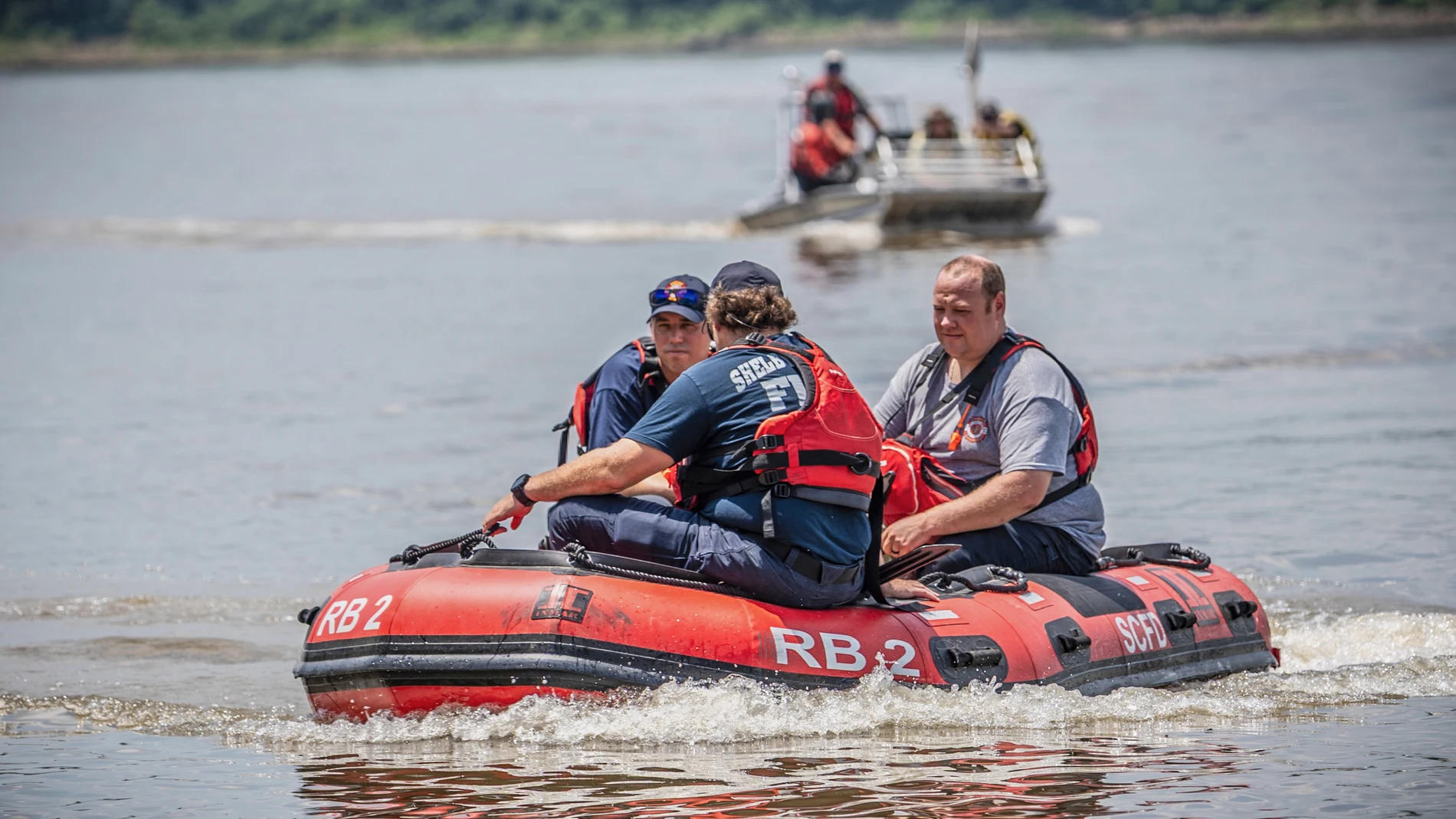 In this photo provided by the Shelby County Sheriff's Office, search and rescue teams look for three men who were reported missing while swimming and fishing on a sandbar in the Mississippi River on Tuesday, July 22, 2025 near Memphis. (Kenneth Hiner/Shelby County Sheriff's Office via AP)