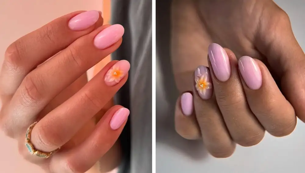 Manicura en rosa chicle con flor 3D y con perlitas en el centro.