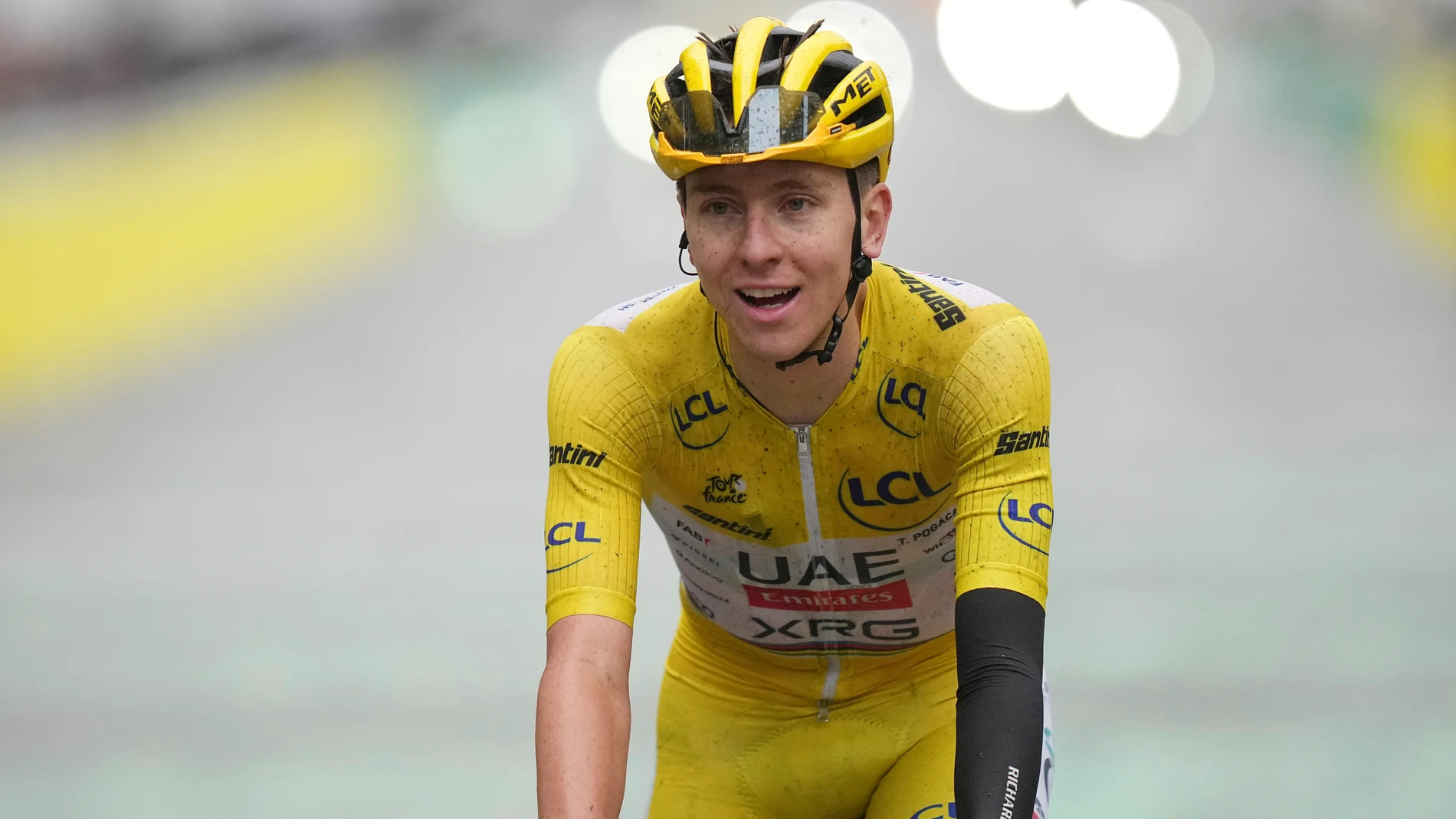 Tour de France winner Tadej Pogacar of Slovenia celebrates when crossing the finish line of the twenty-first stage of the Tour de France cycling race over 132.3 kilometers (82.1 miles) with start in Mantes-la-Ville and finish on the Champs-Elysees in Paris, France, Sunday, July 27, 2025. (AP Photo/Thibault Camus)