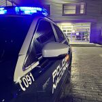 Coche patrulla y comisaría de la Policía Nacional de Valladolid