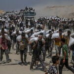 Aid enters Gaza Strip after Israel announces daily pause of hostilities