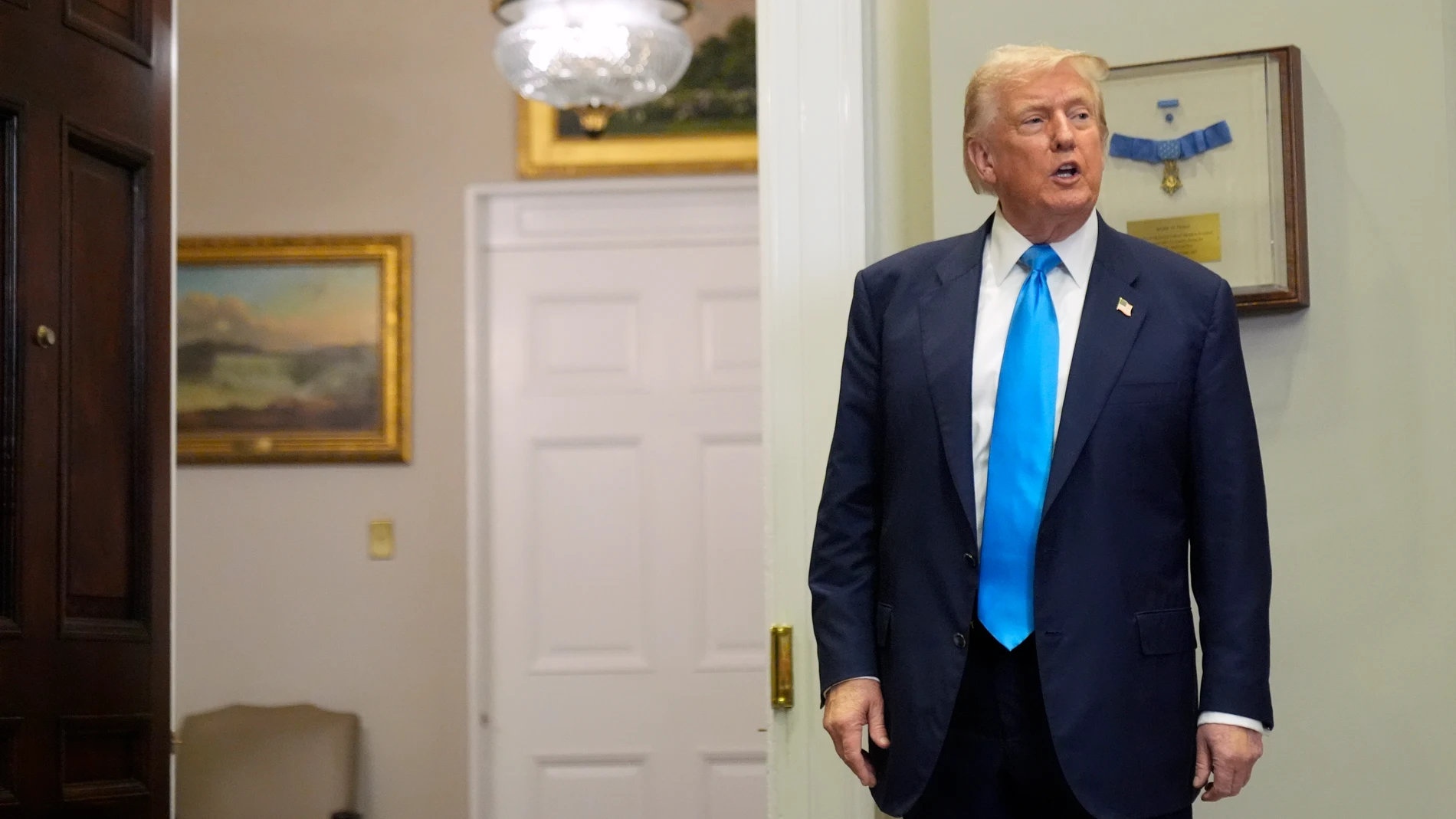 President Donald Trump leaves after an event to sign VA Home Loan Program Reform Act into law in the Roosevelt Room at the White House, Wednesday, July 30, 2025, in Washington. (AP Photo/Mark Schiefelbein)