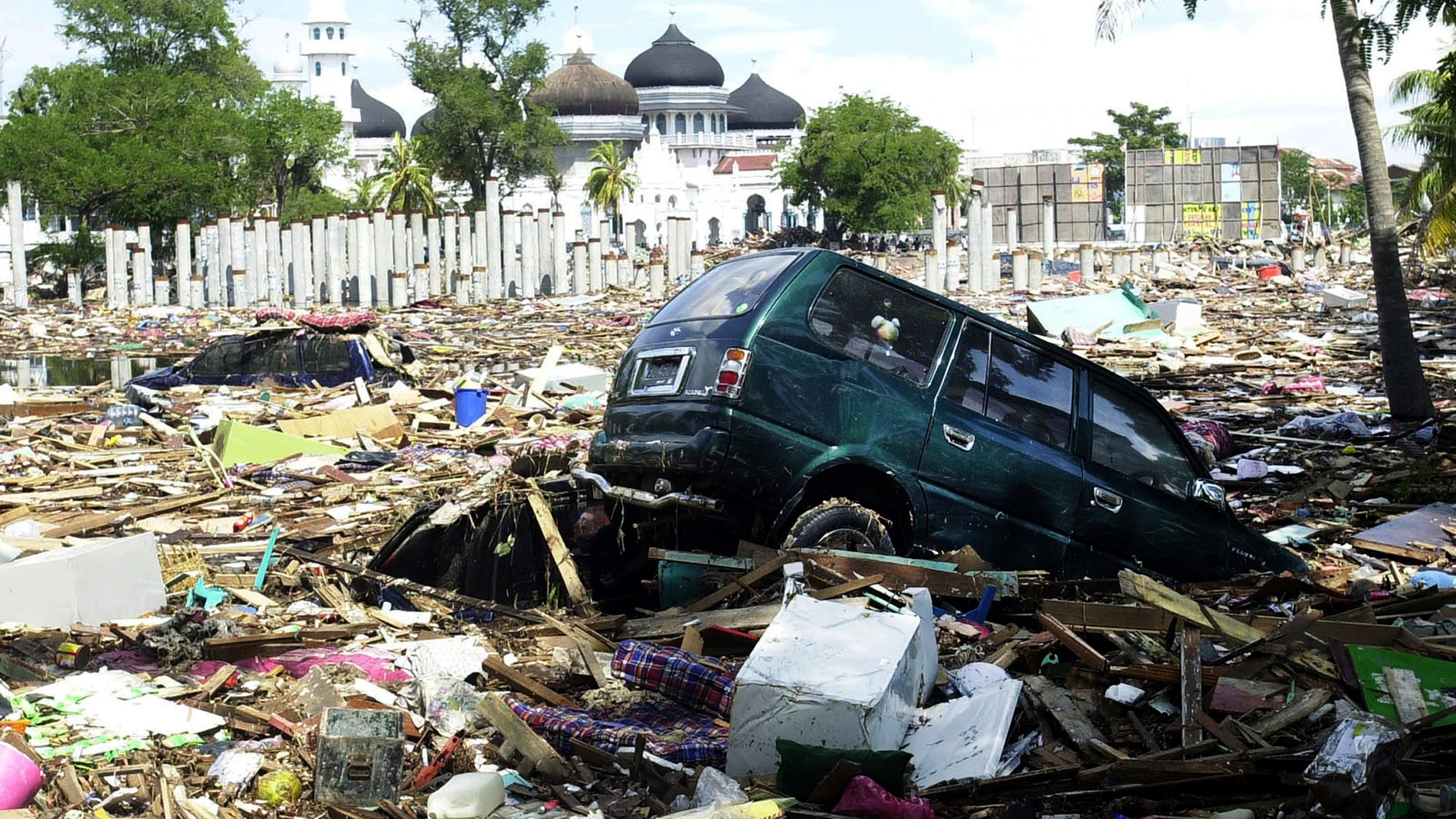 In this Dec. 27, 2004 file photo, debris litter the front lawn of Baiturrahman Grand Mosque after gigantic waves swept in Banda Aceh, Aceh province, Indonesia. (AP Photo/Achmad Ibrahim, File)
