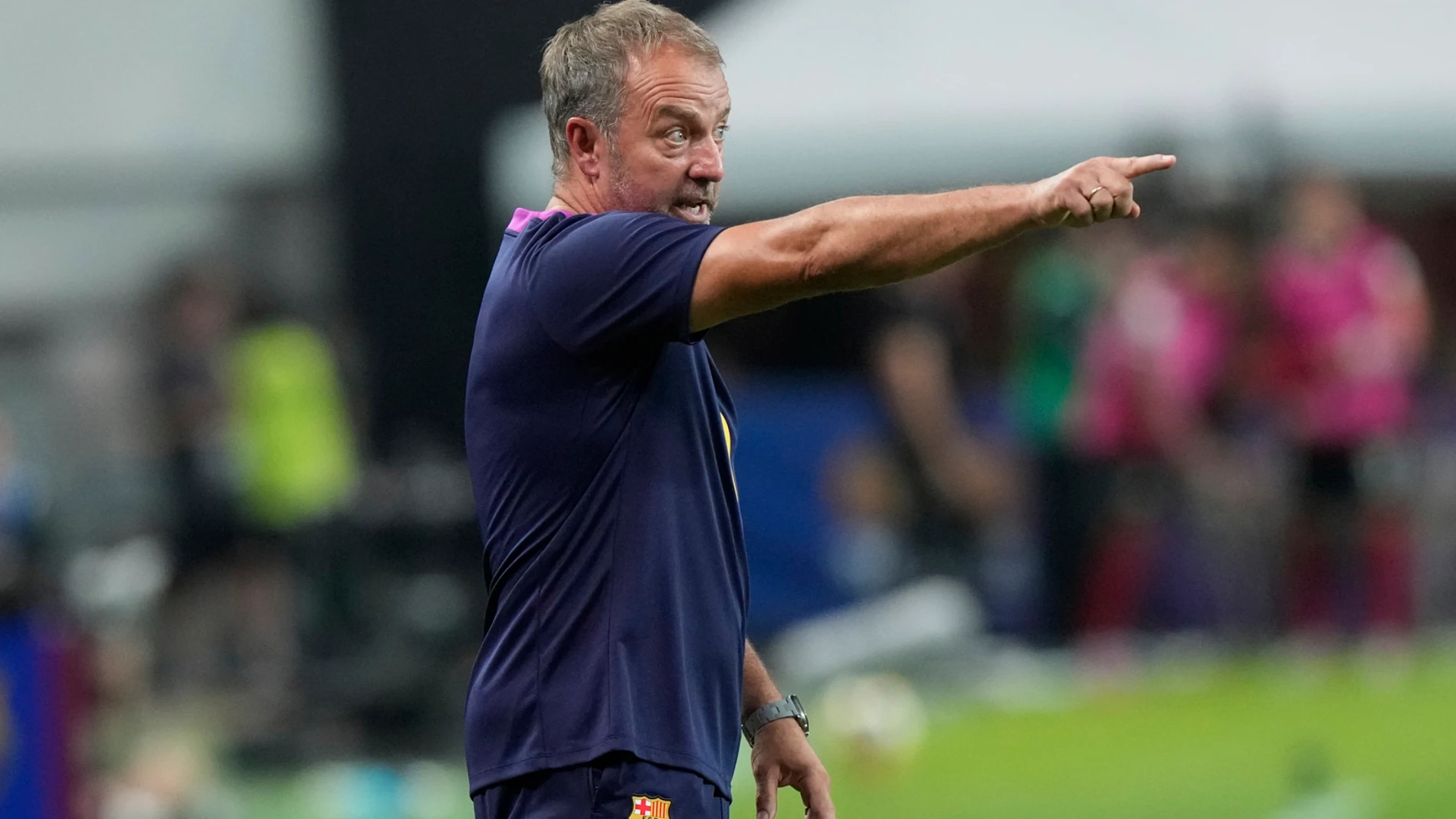FC Barcelona's head coach Hansi Flick reacts during a friendly match between FC Barcelona and FC Seoul at the Seoul World Cup Stadium in Seoul, South Korea, Thursday, July 31, 2025. (AP Photo/Ahn Young-joon)