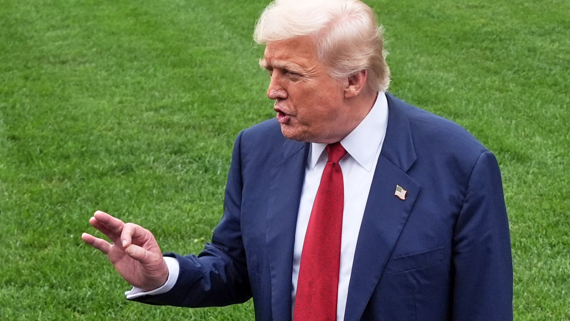 President Donald Trump speaks with reporters before walking across the South Lawn of the White House to board Marine One en route to Joint Base Andrews, Md., Friday, Aug. 1, 2025, in Washington. (AP Photo/Jacquelyn Martin)